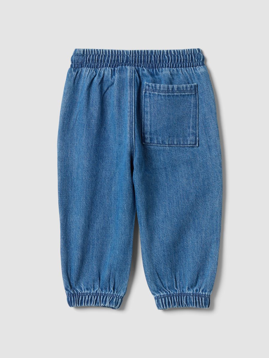 Blue denim trousers in a cotton and viscose blend with an elasticated waistband_1