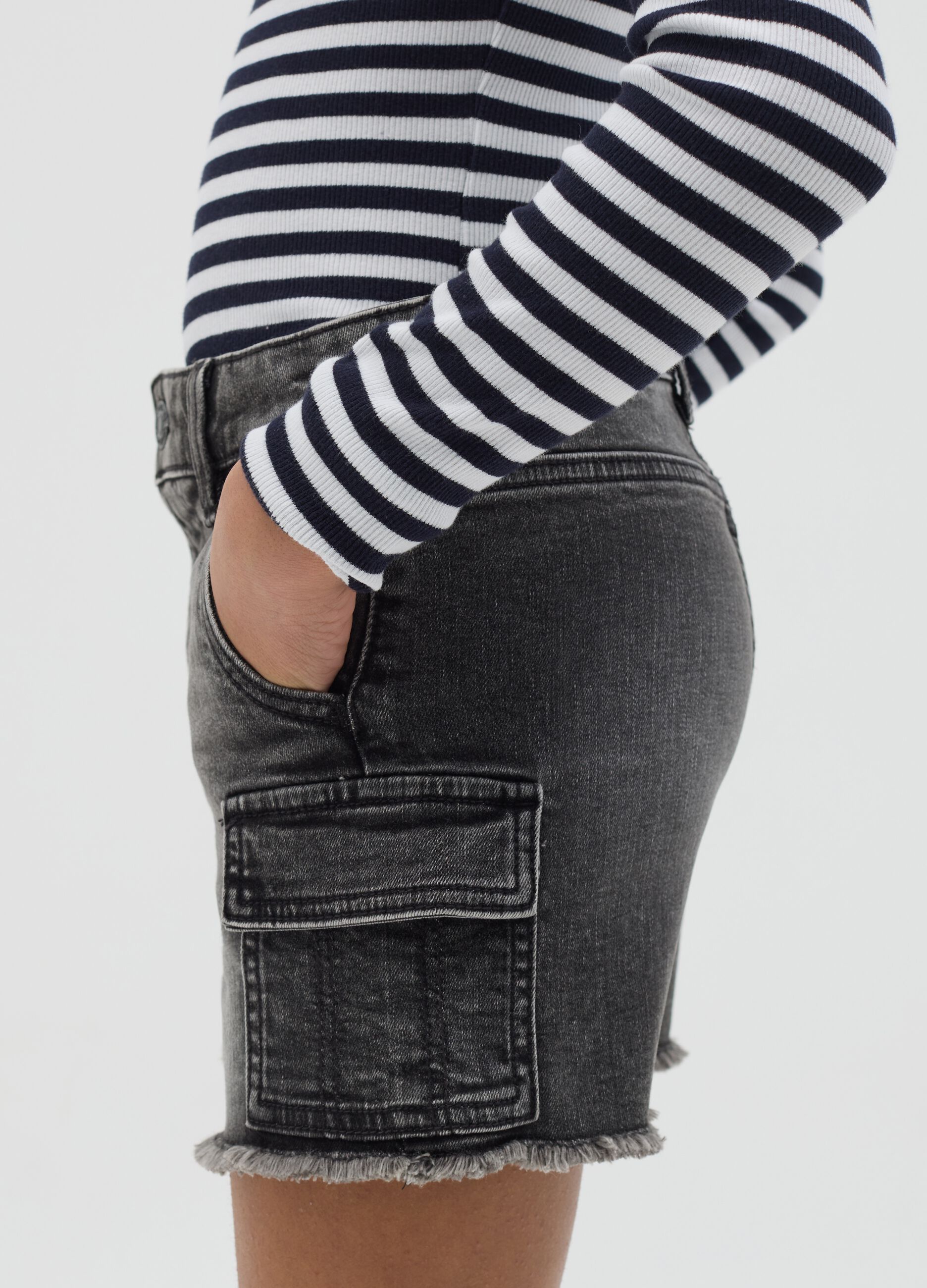 Black cargo shorts with fringed hem
