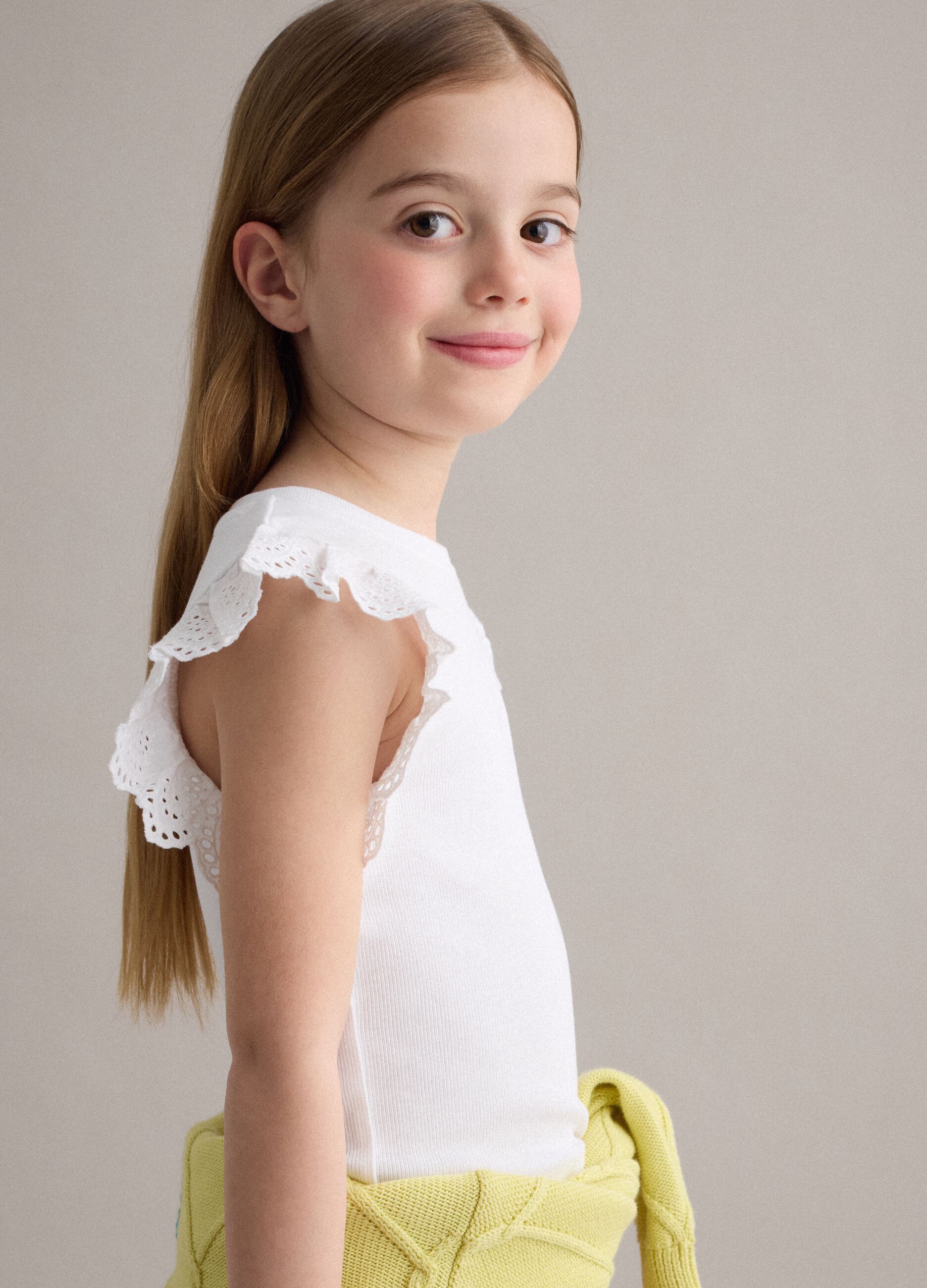 White stretch cotton girls&rsquo; vest top with ruffles