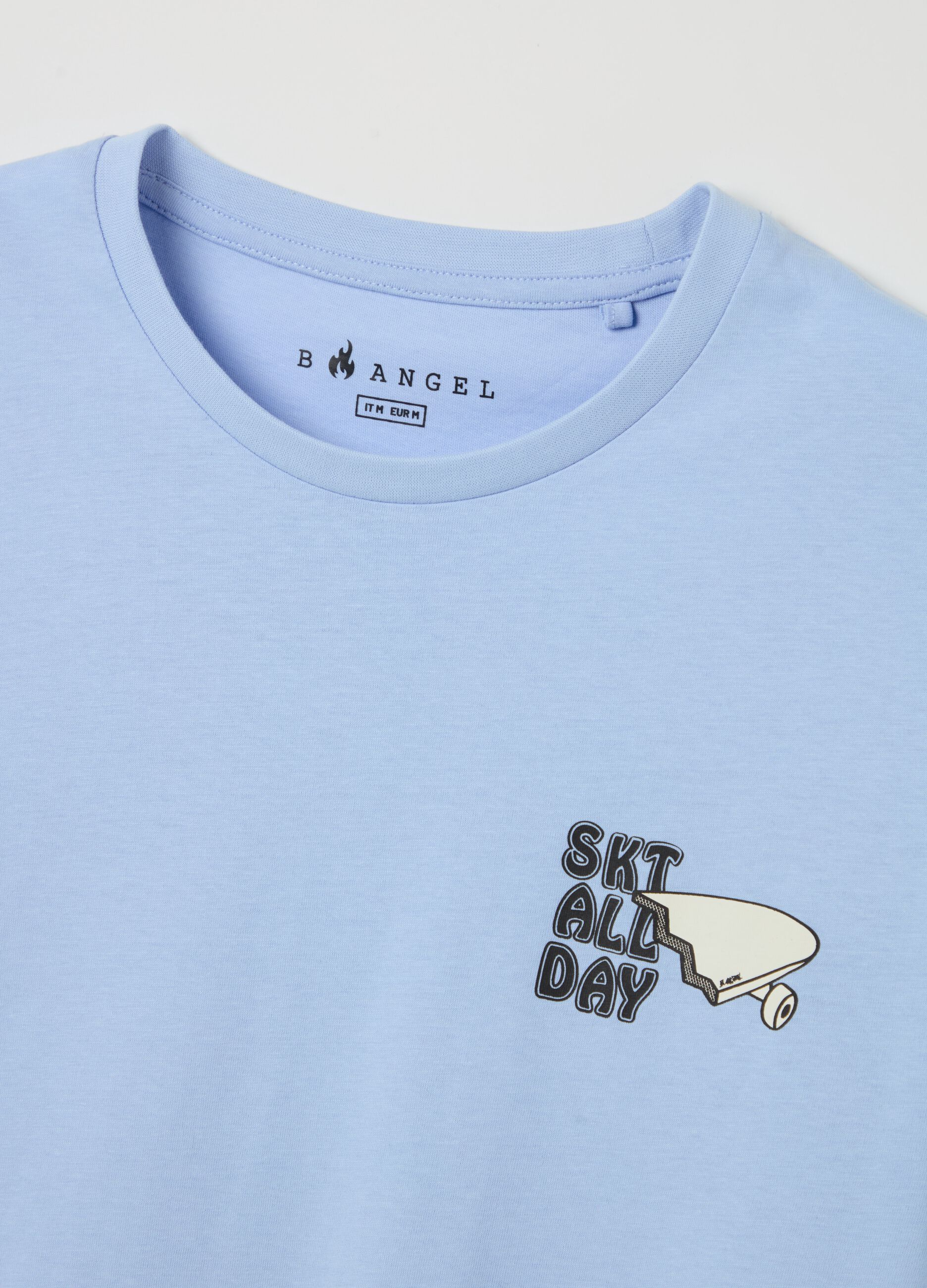 Light blue T-shirt with skateboards print