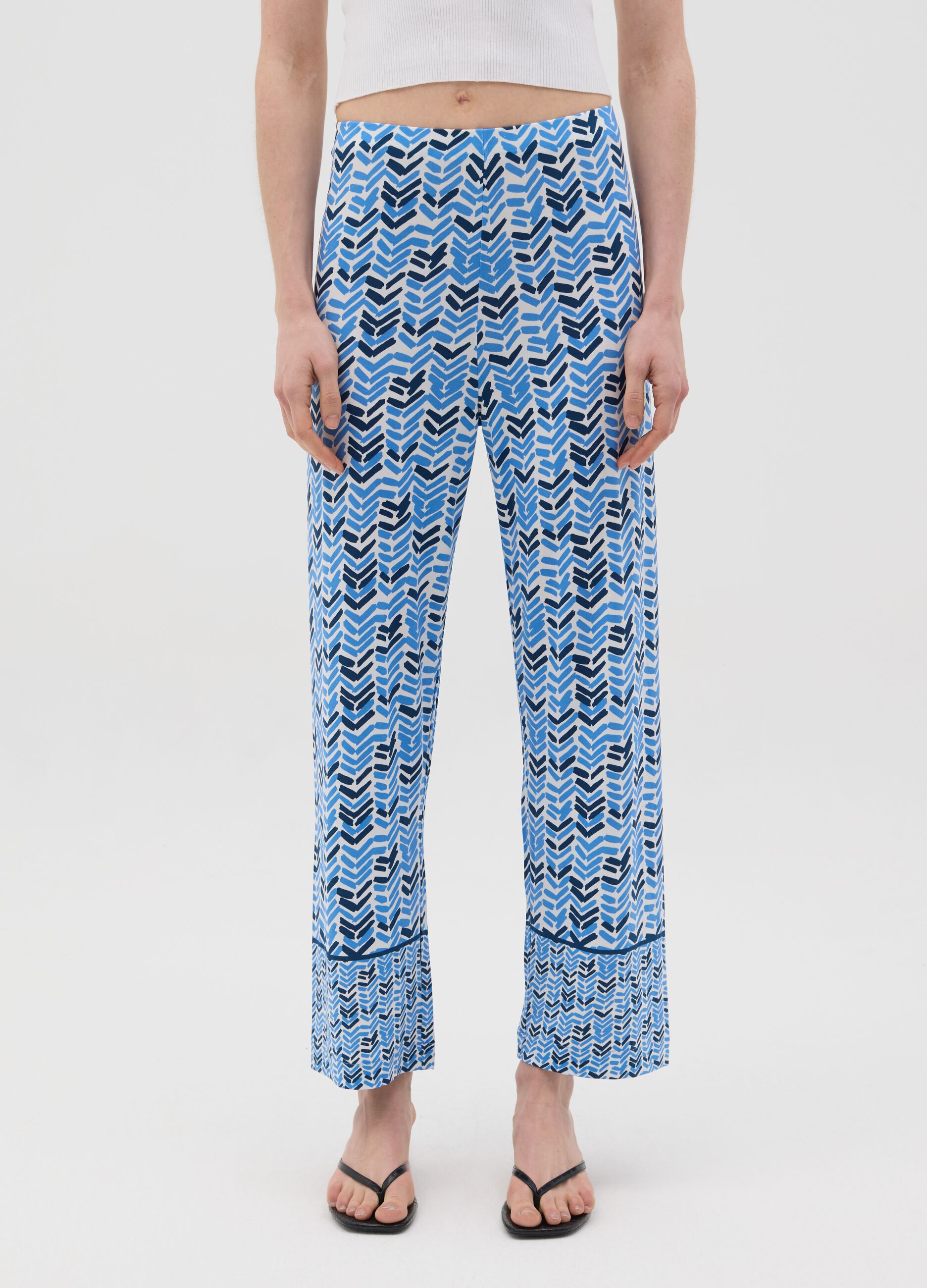 Blue jersey trousers with geometric pattern