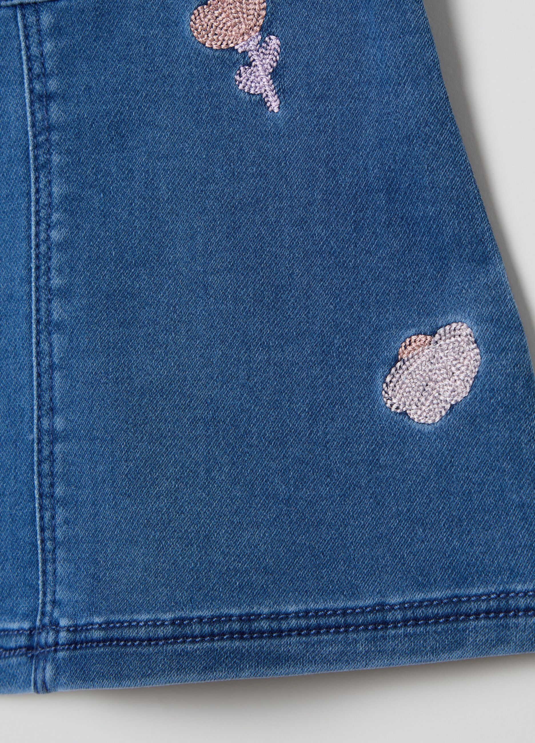 Denim pinafore with flowers embroidery