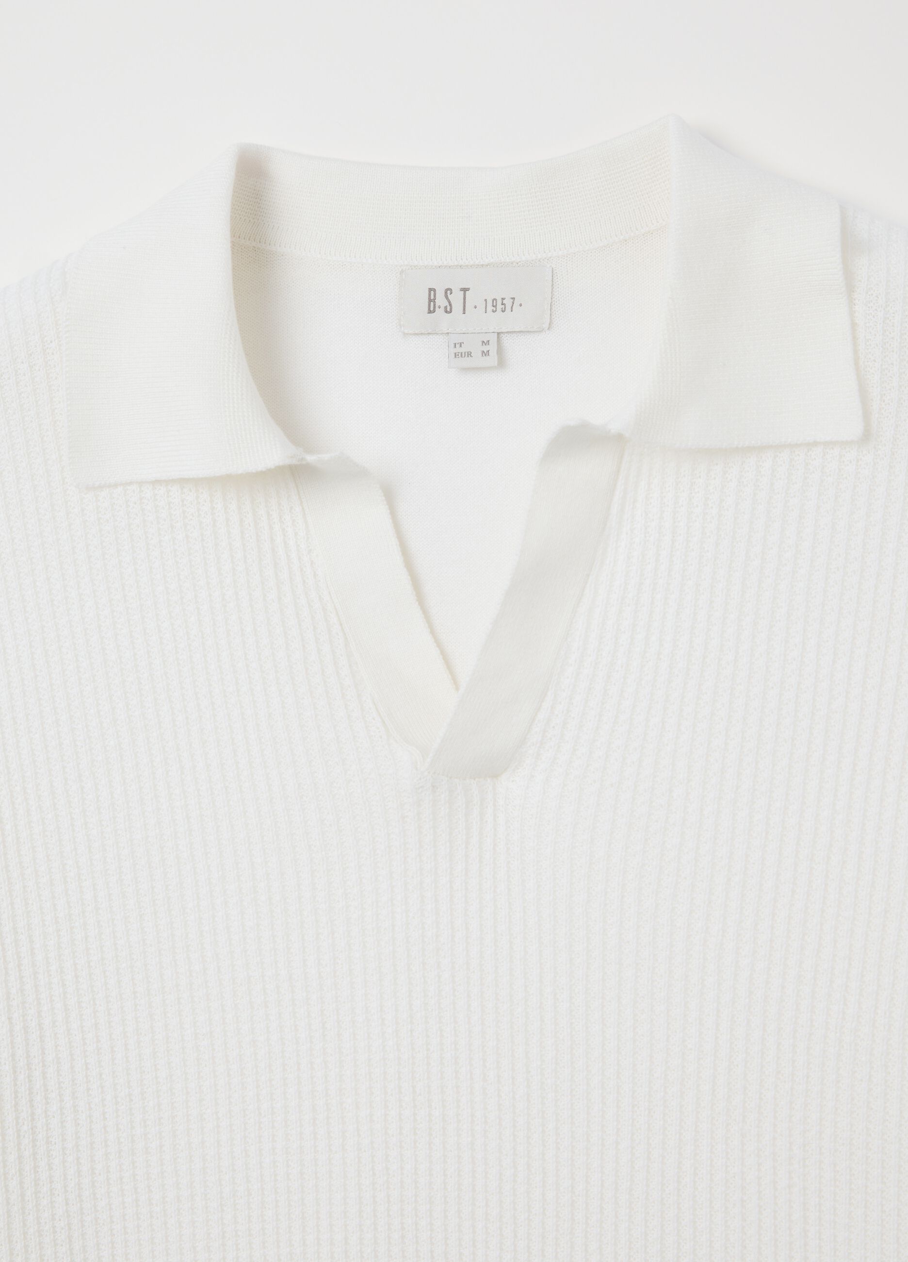 Polo bianca in maglia con trama jacquard