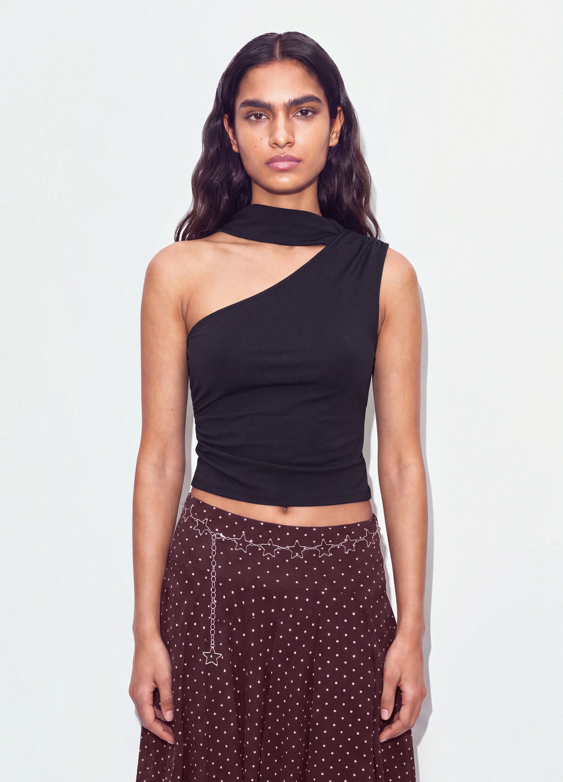 Black stretch top with asymmetric neckline and draped band