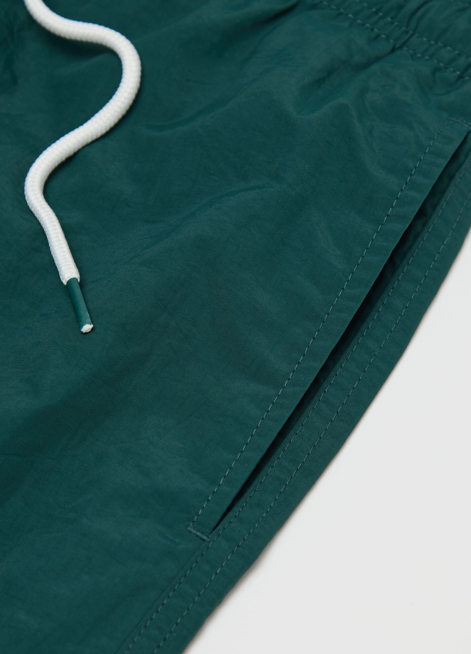 Green mixed fabric swim shorts