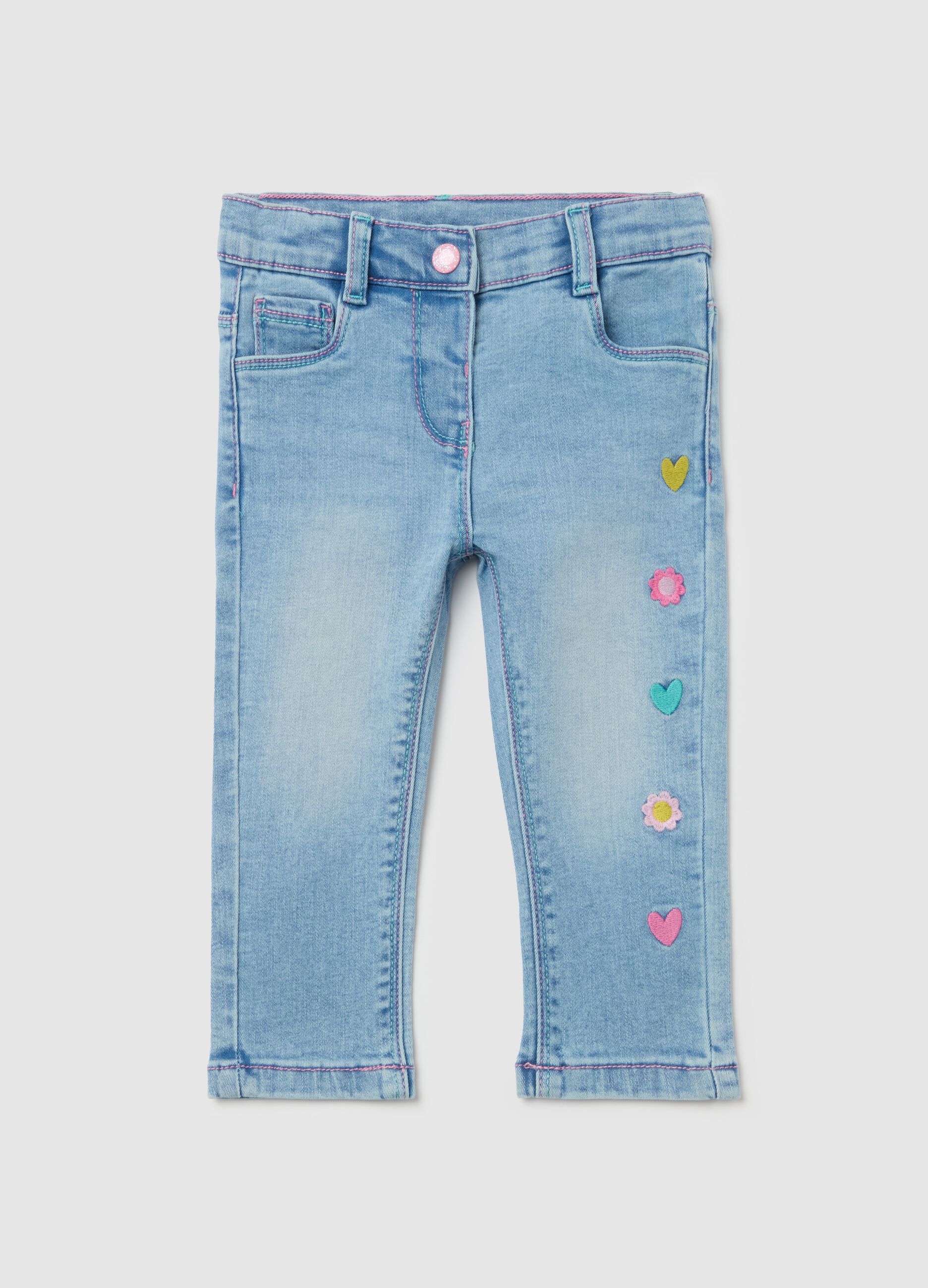 Jeans with five pockets and hearts and flowers embroidery