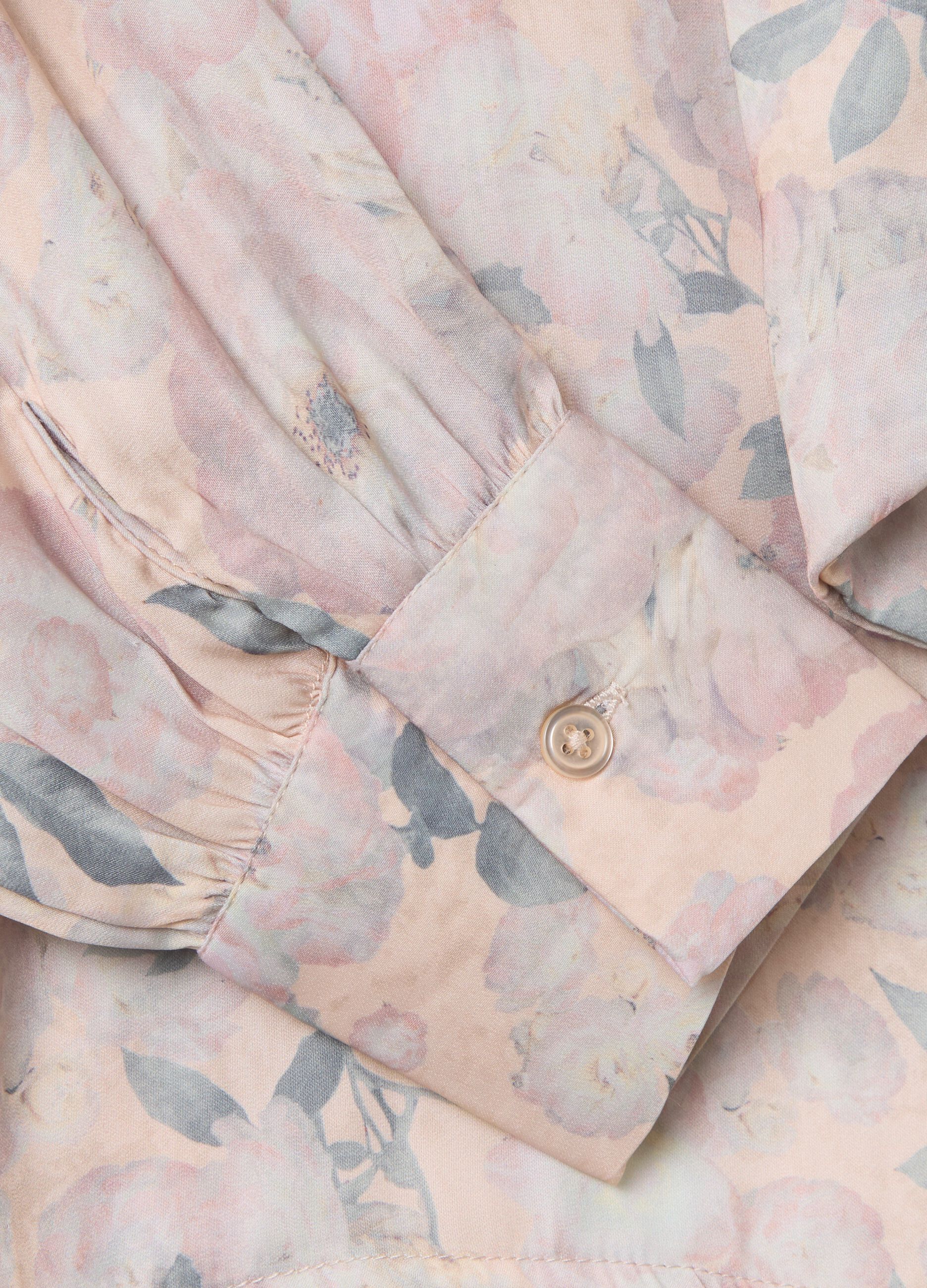 Beige blouse with floral pattern and bow
