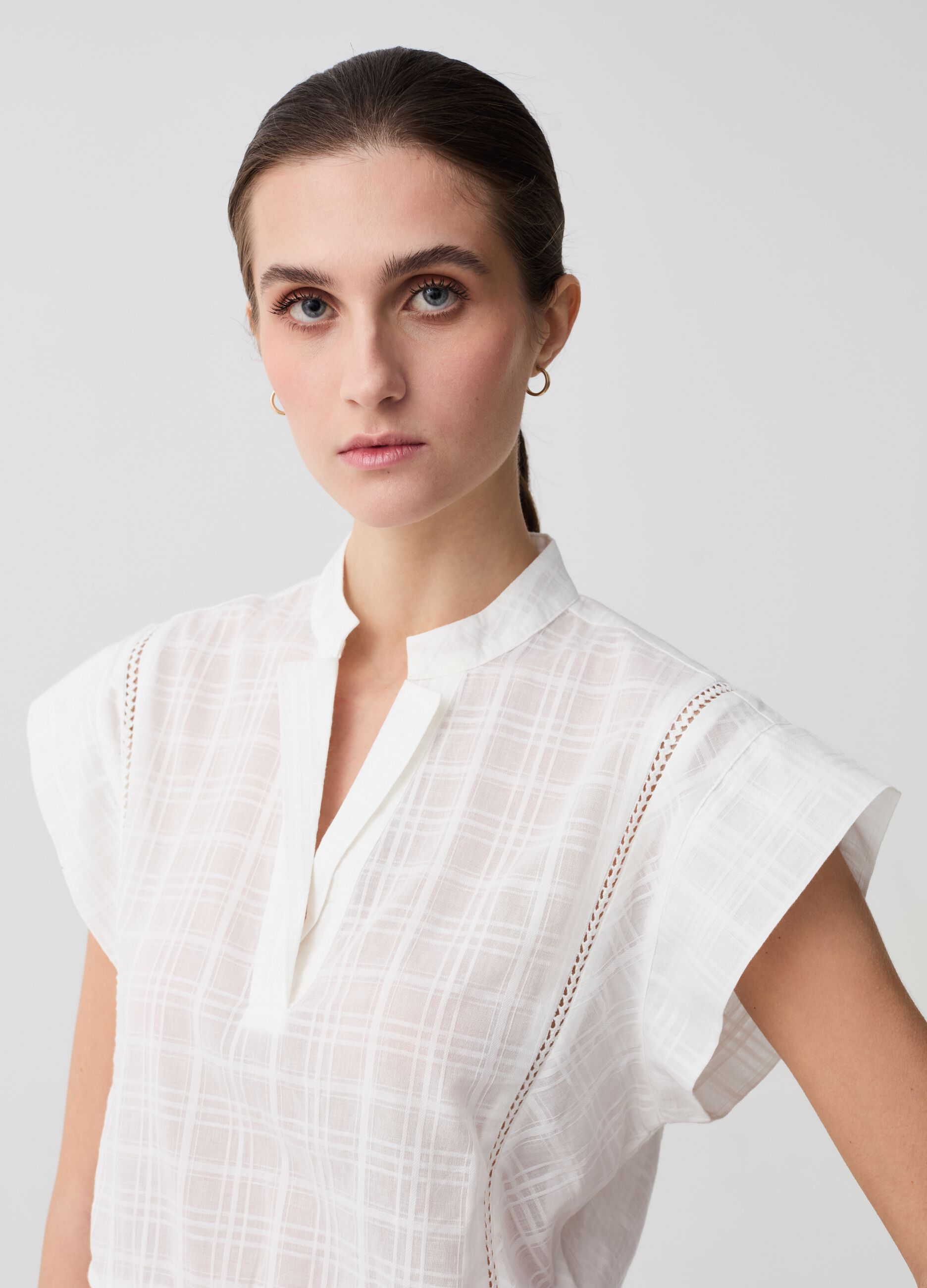 Blouse with check design and à jour embroidery