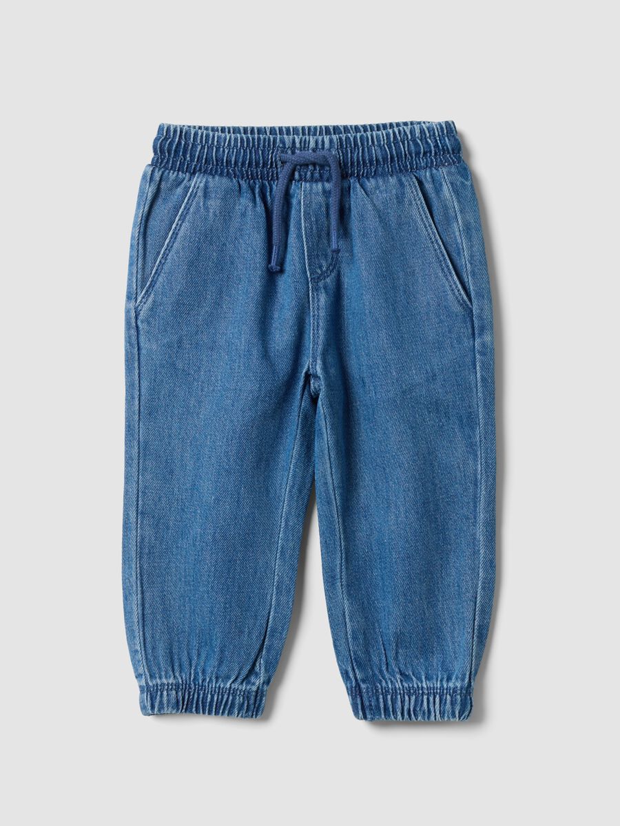 Blue denim trousers in a cotton and viscose blend with an elasticated waistband_0