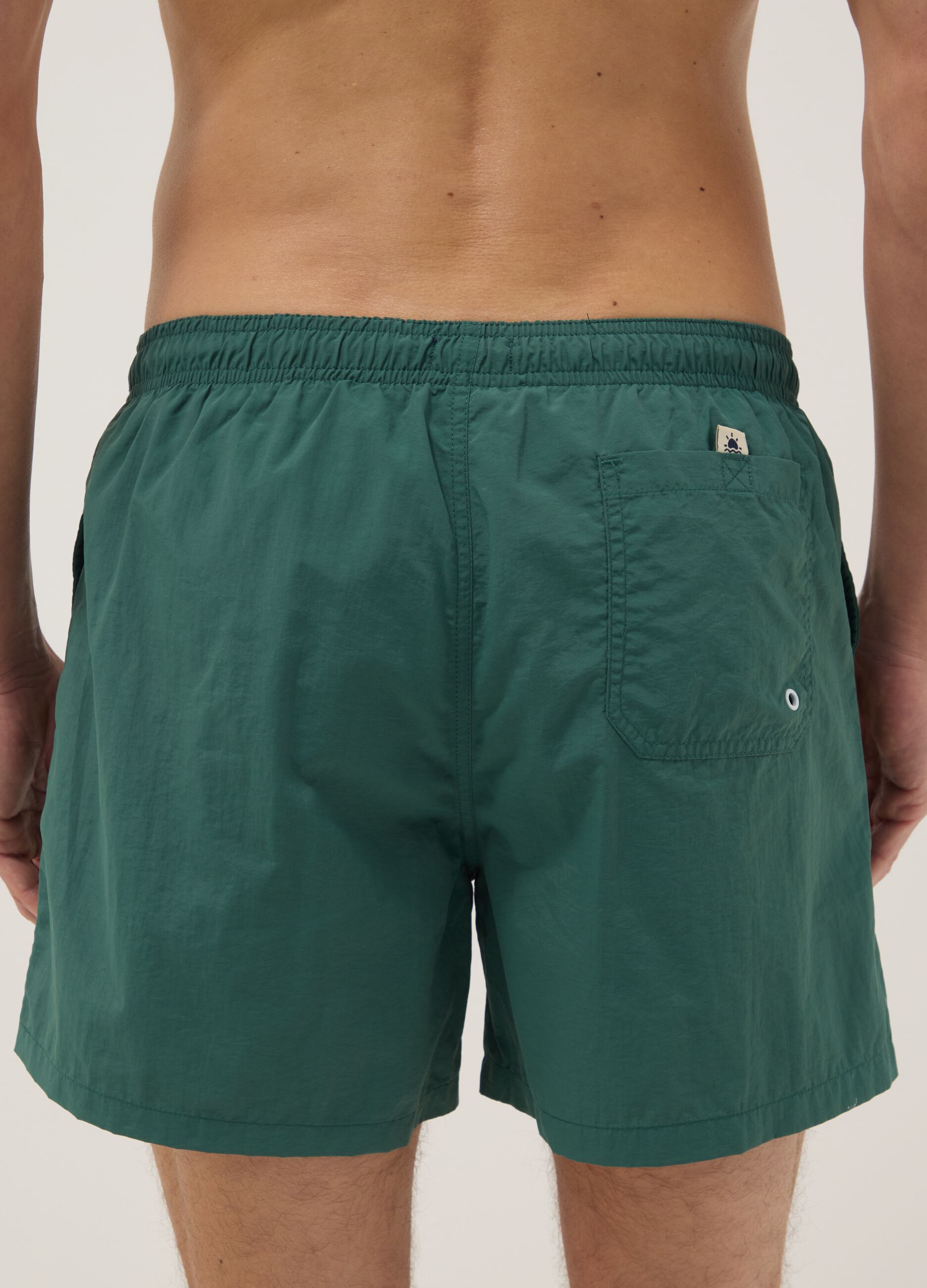 Green swim shorts with elasticated waist