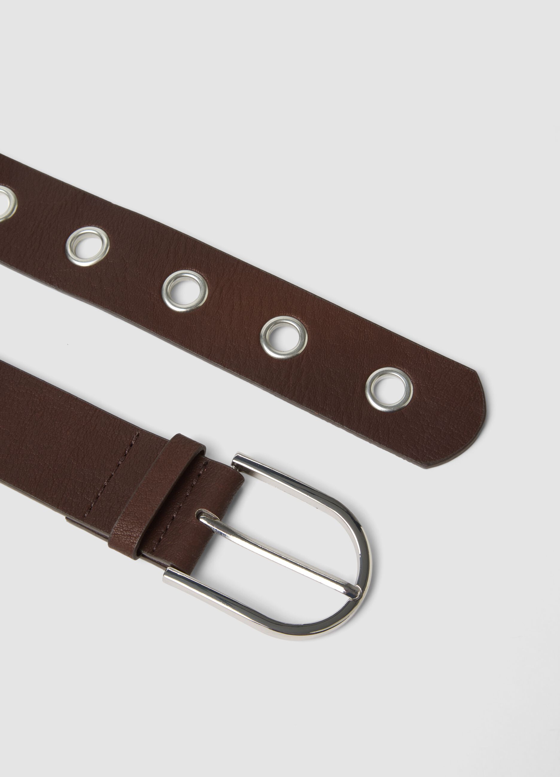 Brown belt with metal eyelets