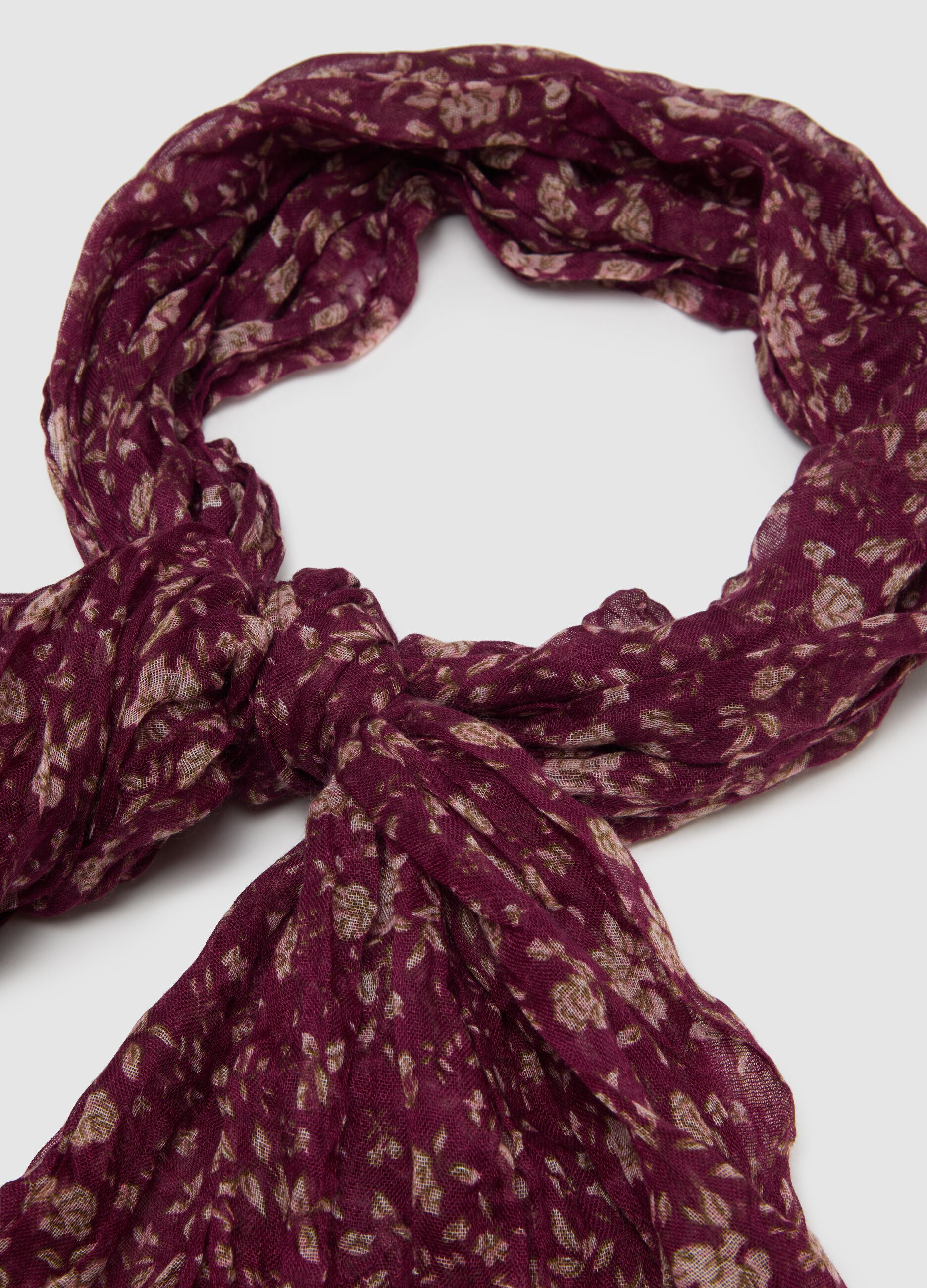 Purple fabric scarf with floral pattern
