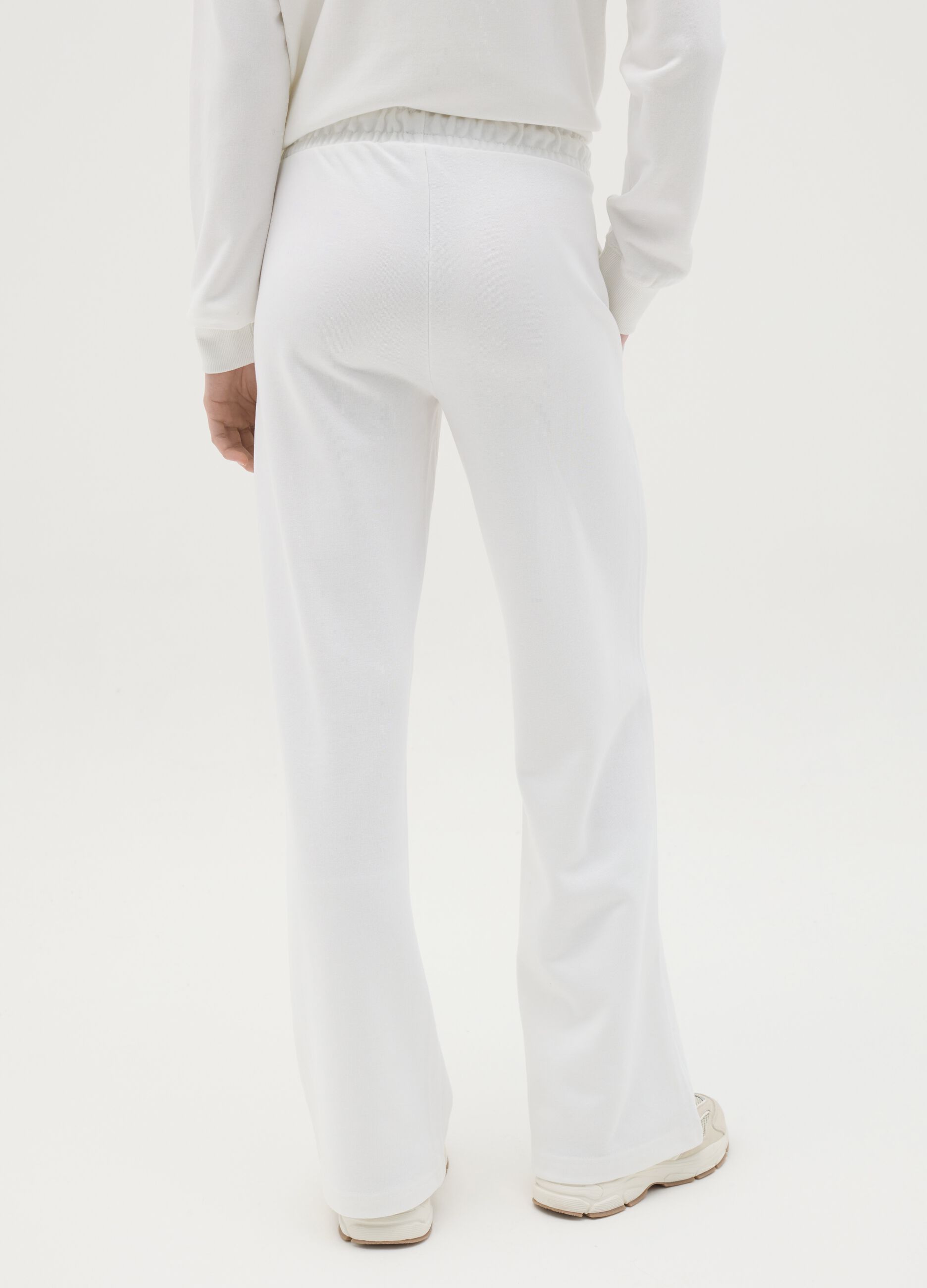 White flare joggers with drawstring and logo print