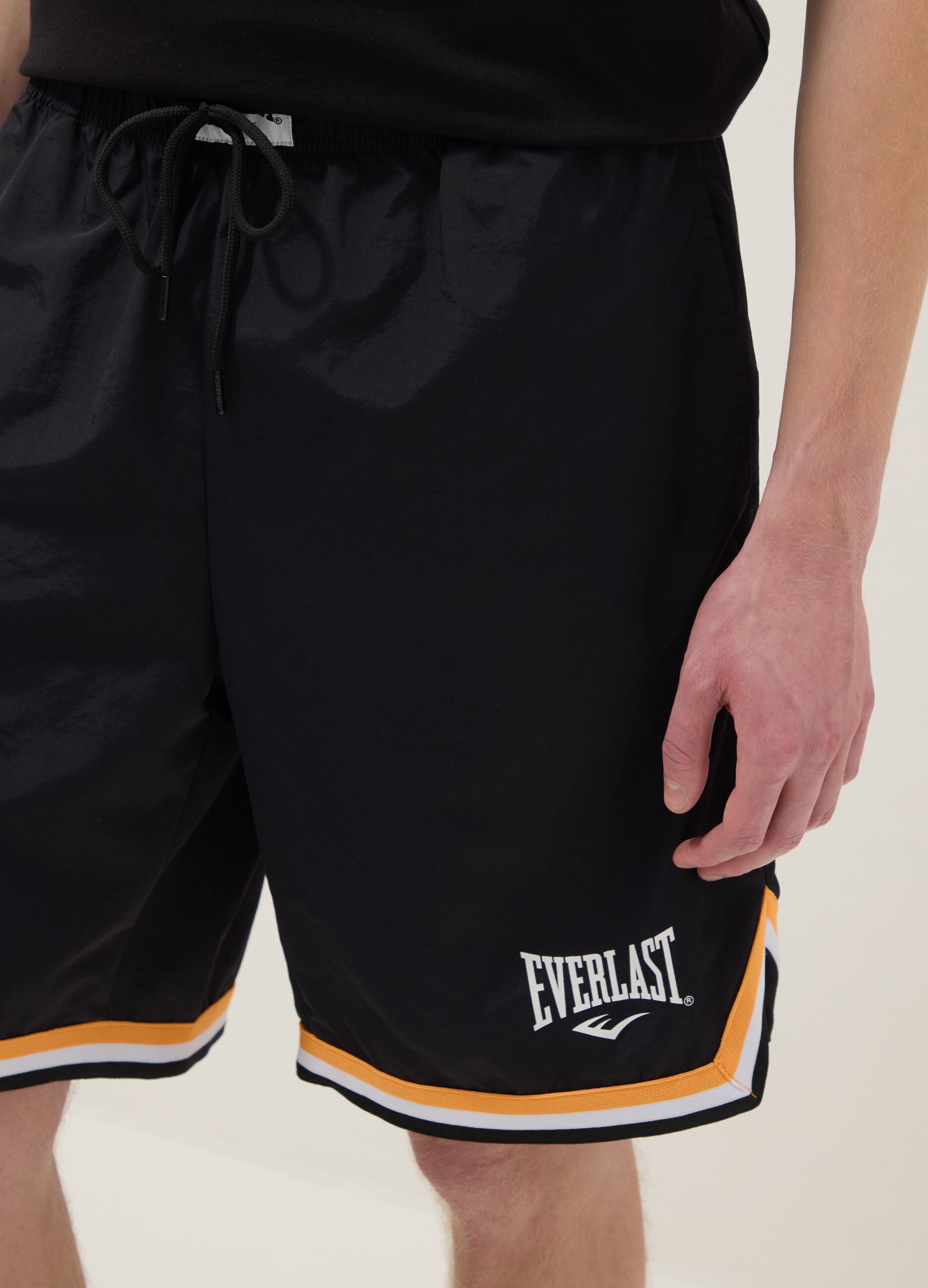 Regular fit black sports shorts with white and orange details