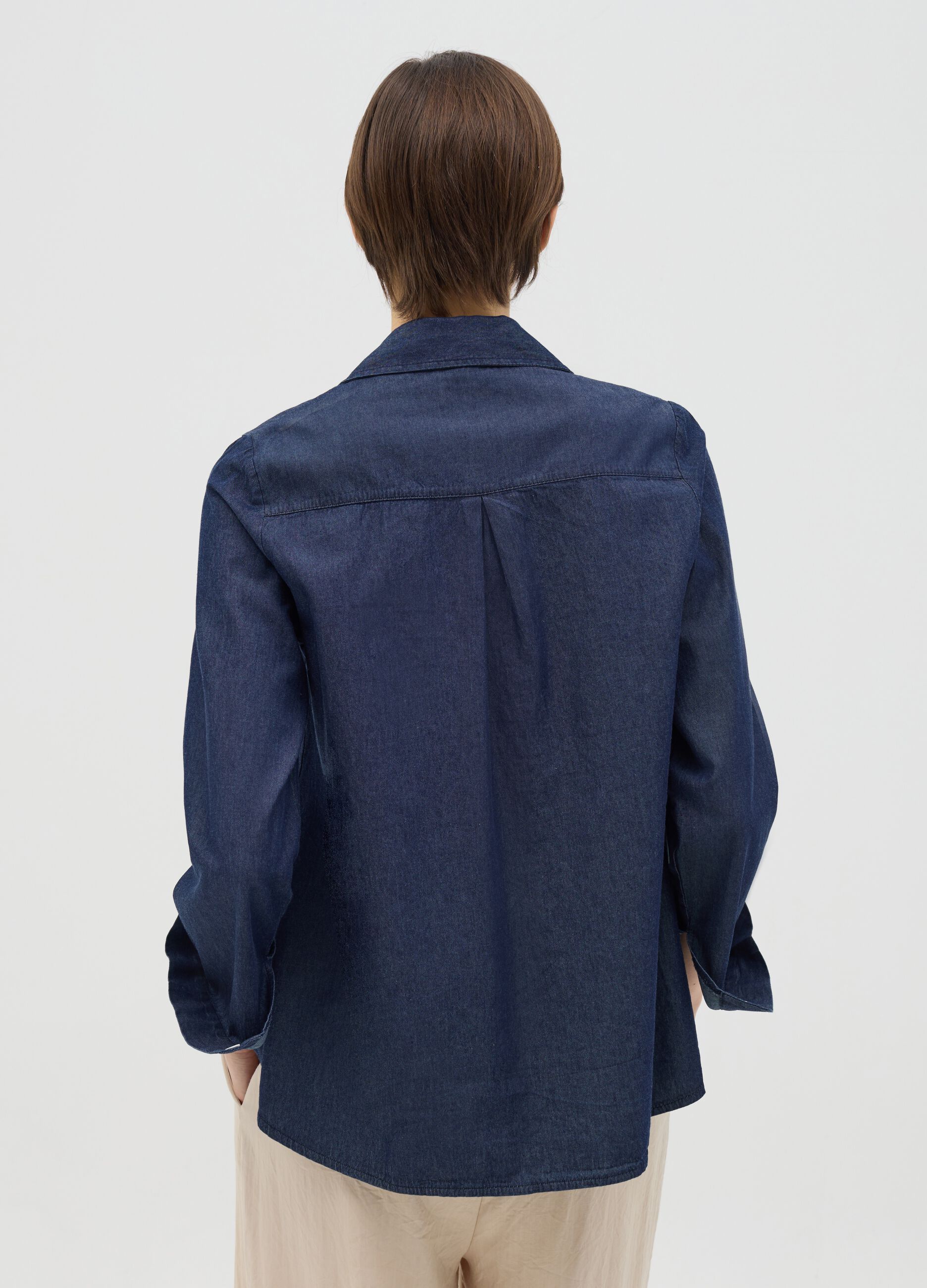 Denim shirt with sequinned patch