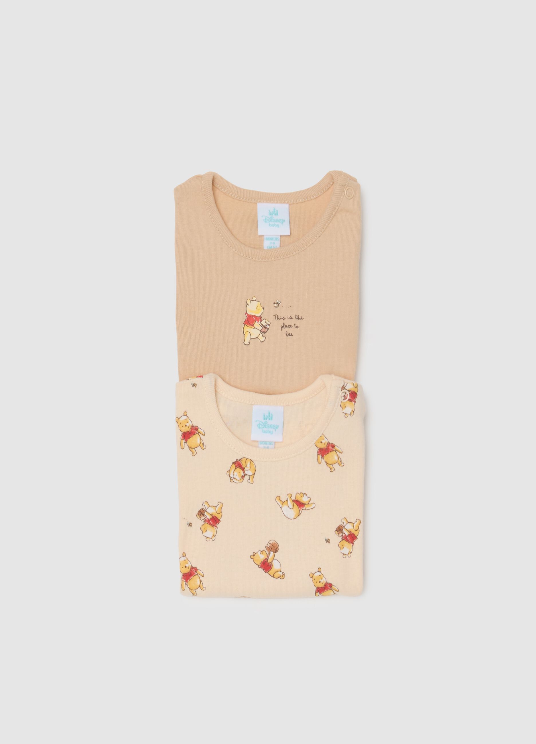Unisex baby bodysuit in pure beige cotton with Winnie the Pooh print