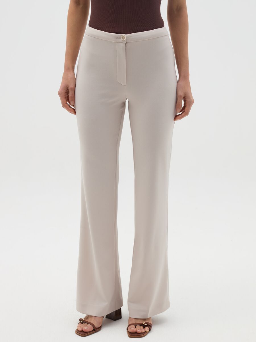 Solid colour flare-fit trousers_1