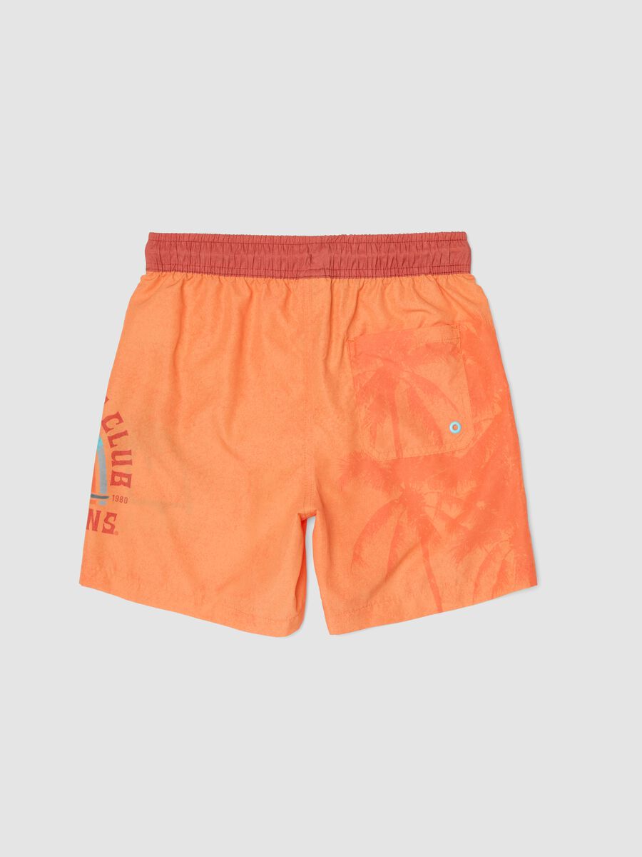 Orange boys&rsquo; swim shorts with tropical print_1