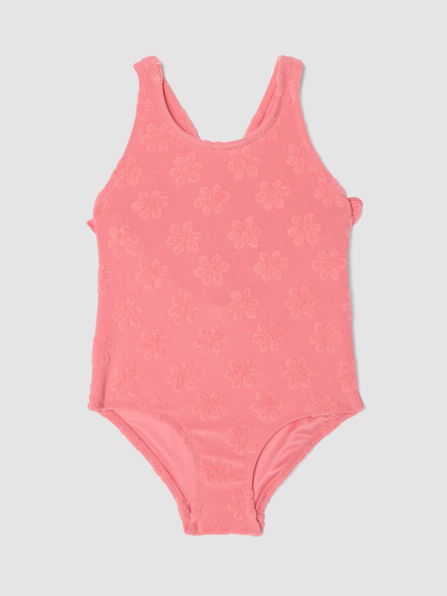 Pink stretch-fabric one-piece swimsuit for baby girls with floral detailing_0