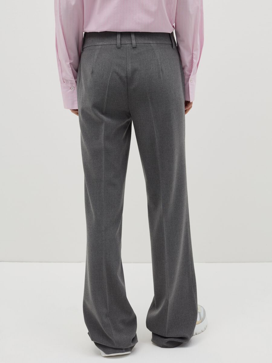 Flare-fit trousers with double button_2