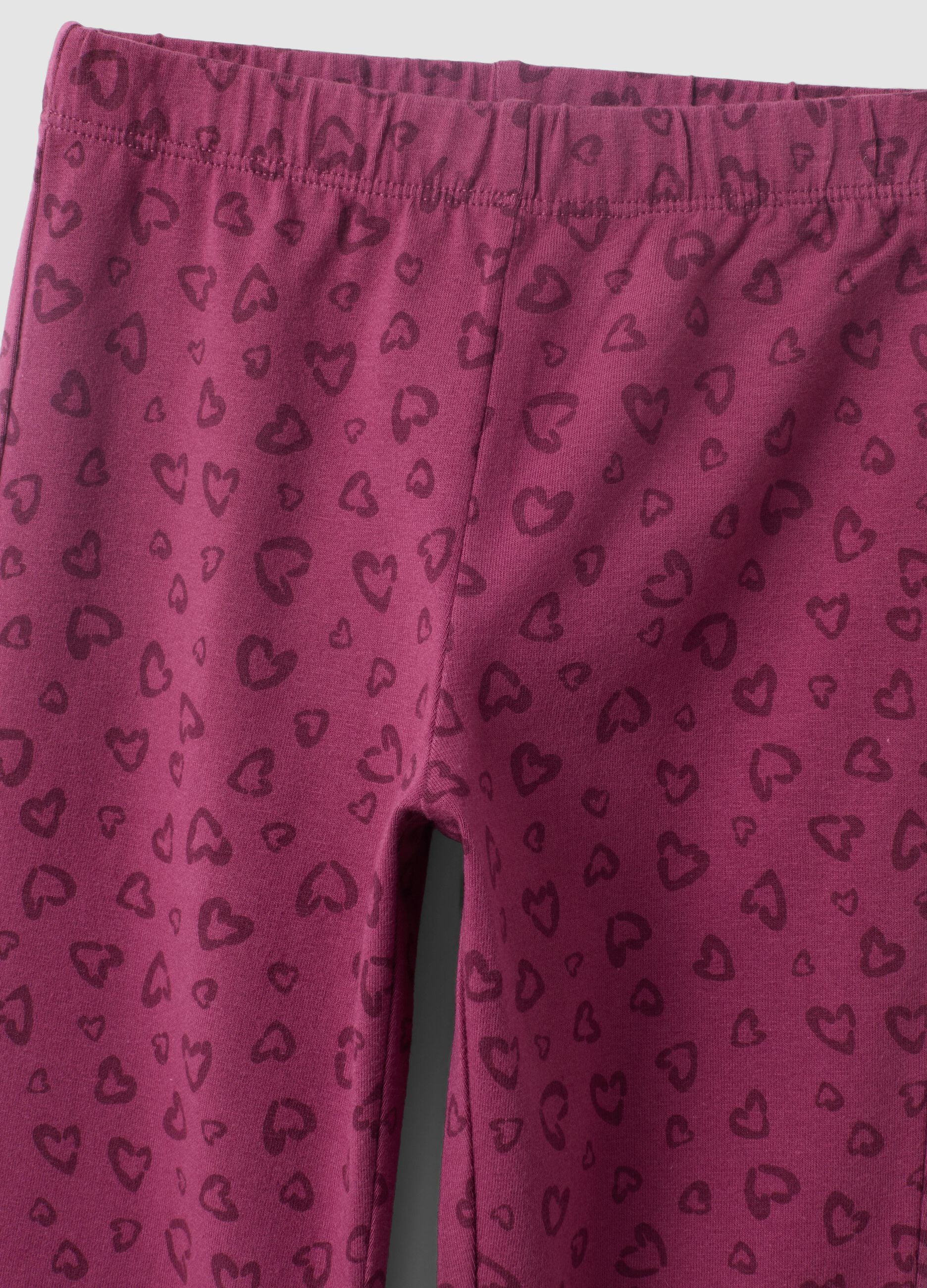 Leggings skinny viola in cotone organico con stampa di cuori per bambina