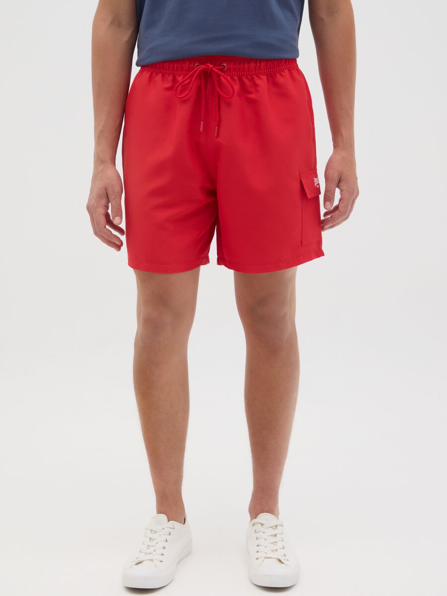 Red swimming trunks with logo print_1