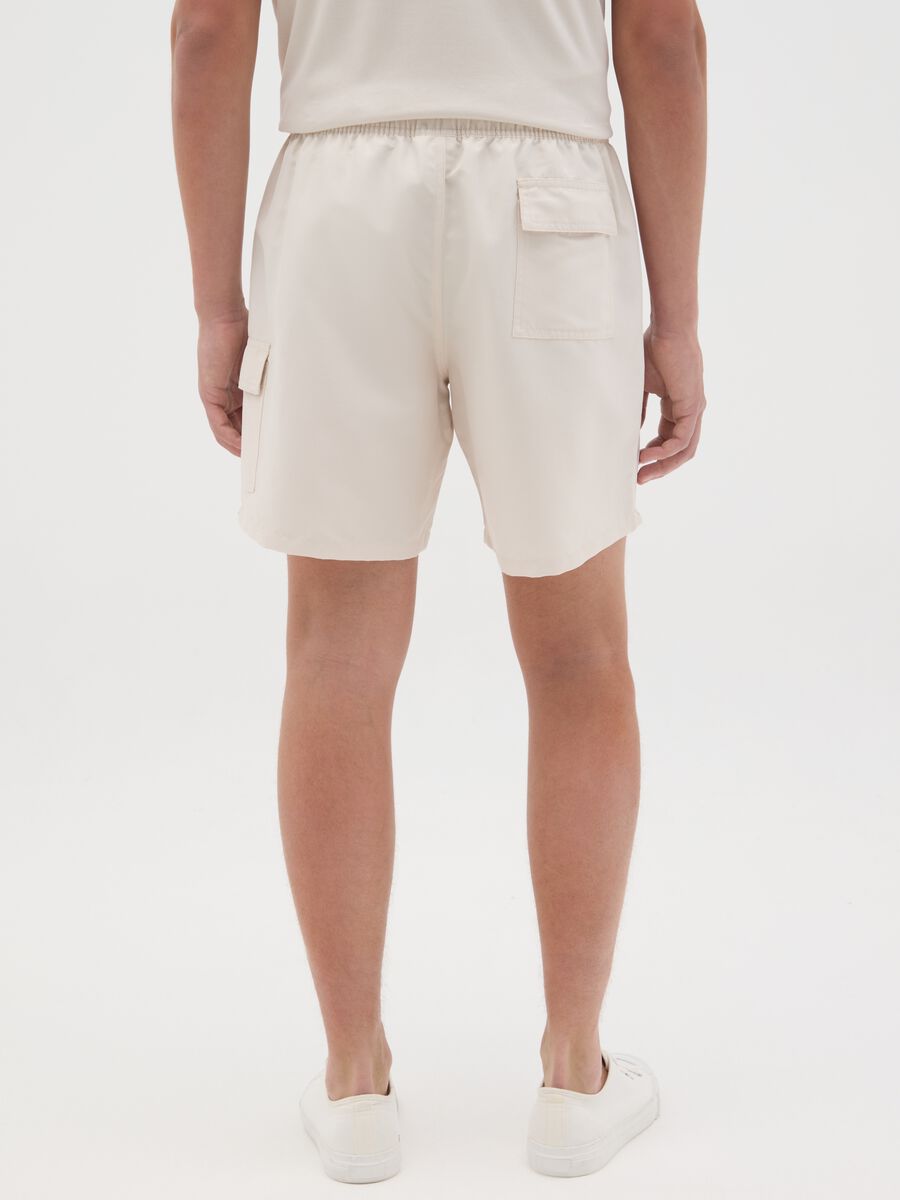 Beige swimming trunks with logo print_3