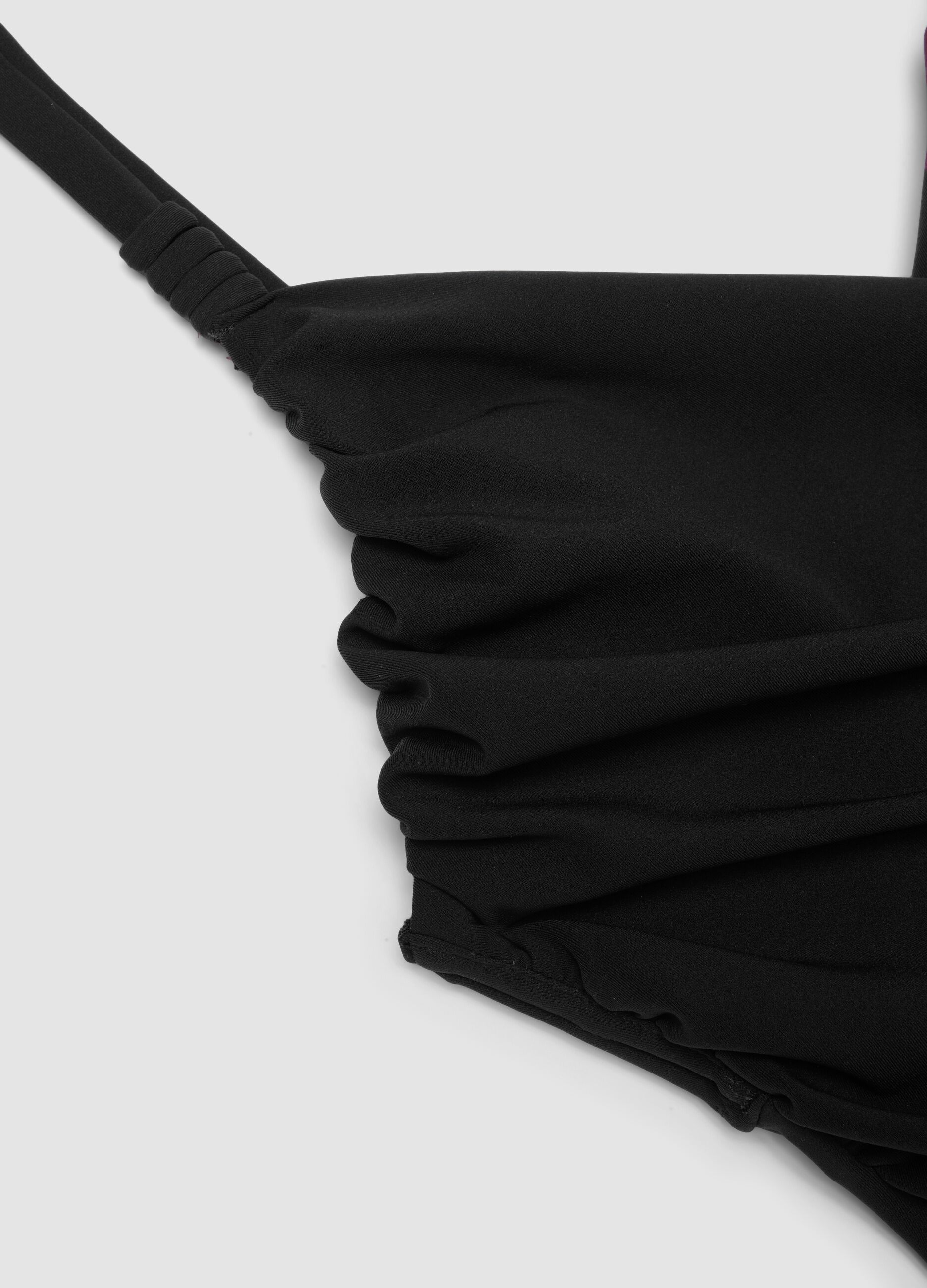Black draped stretch swimsuit with shaping effect