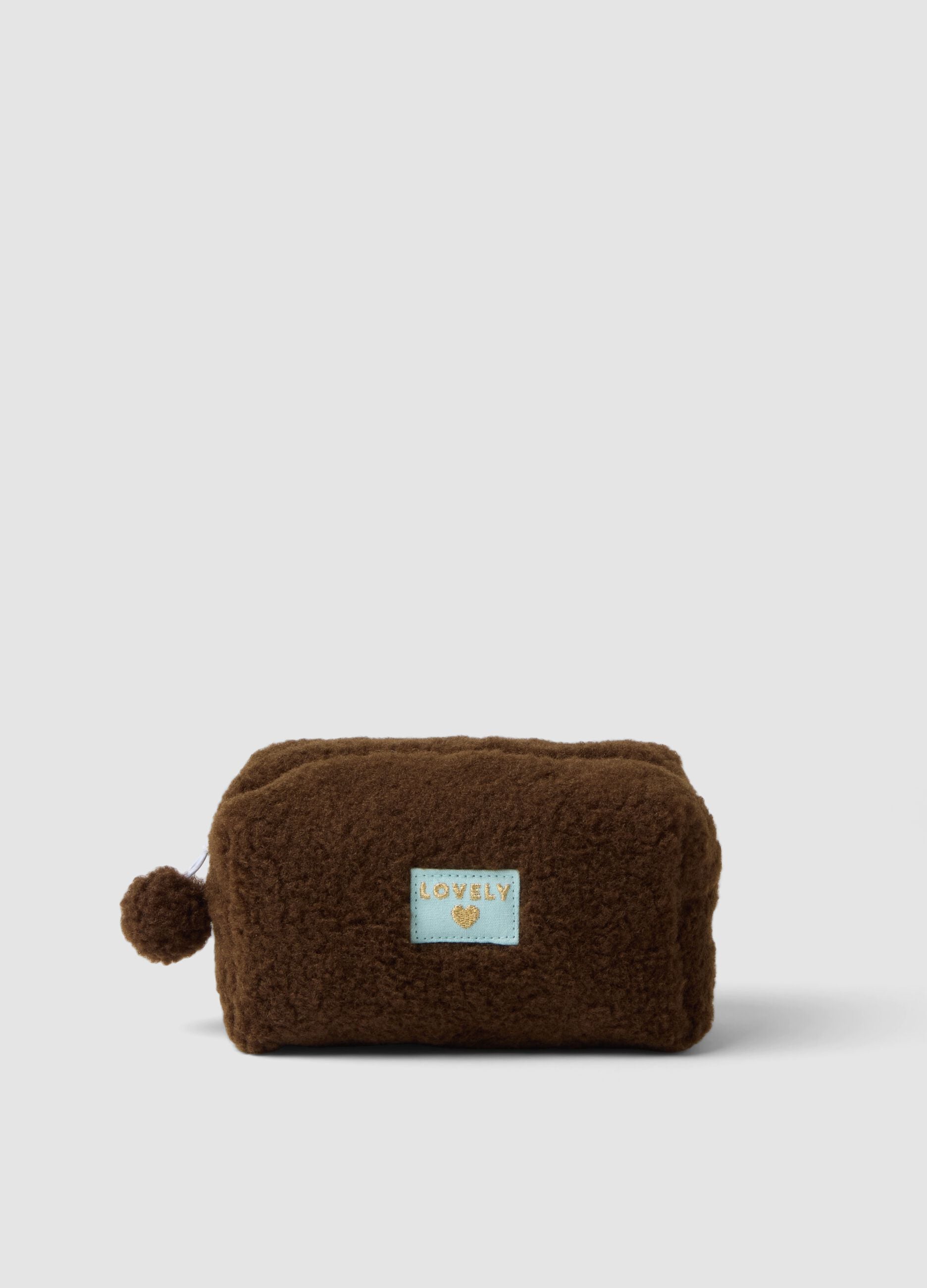 Brown beauty case with pompom