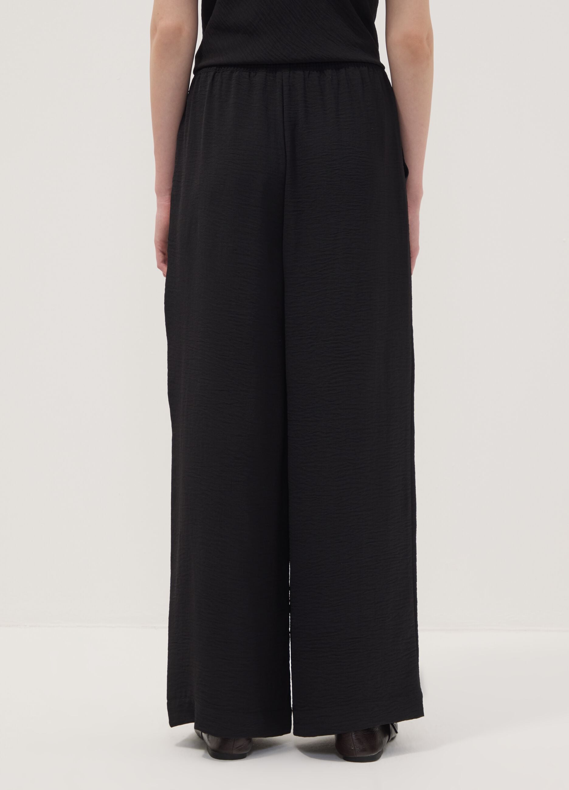 Black wide-leg trousers with elasticated waist