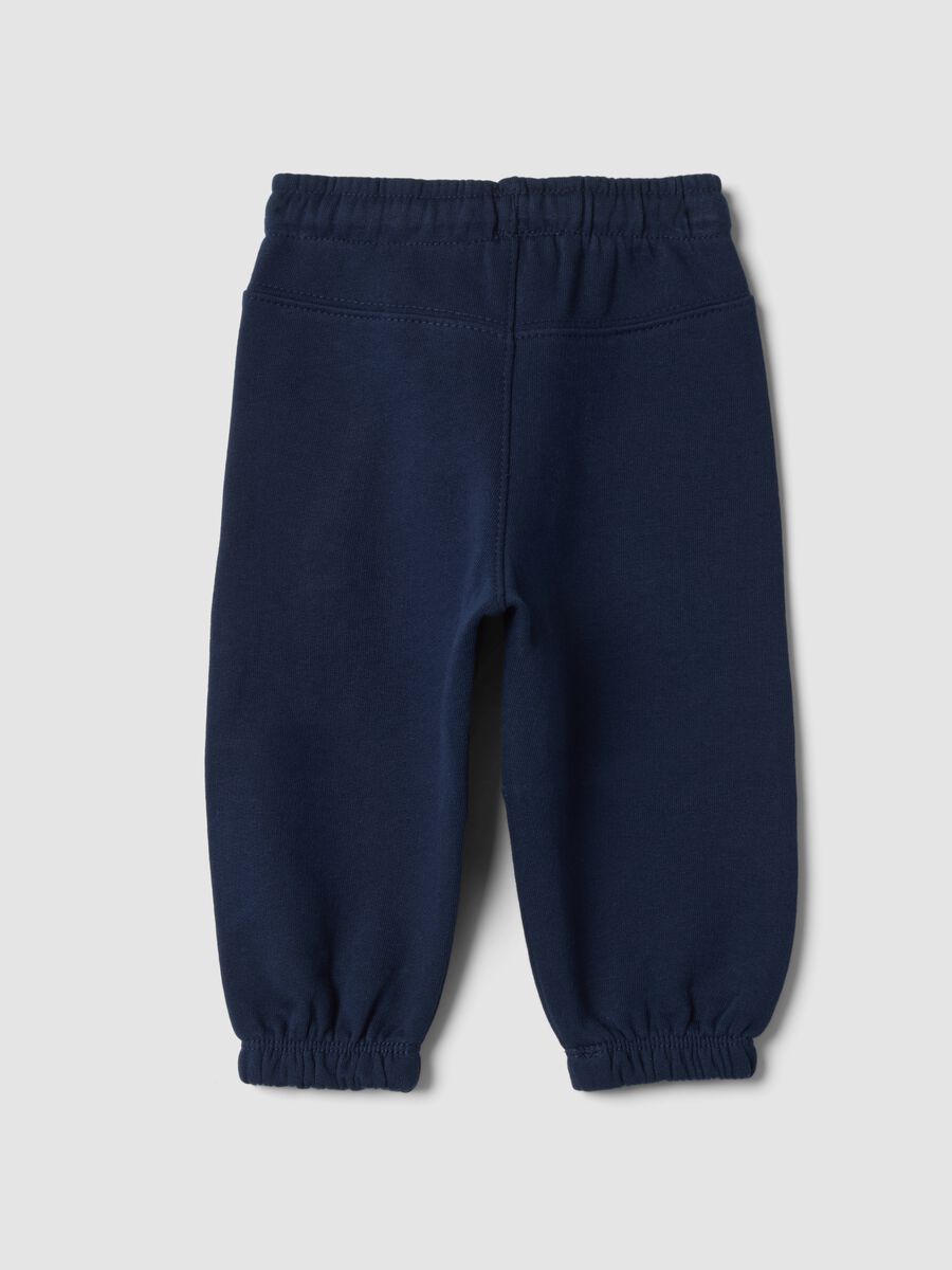 Pantaloni blu in puro cotone con stampa dinosauro over fit_1