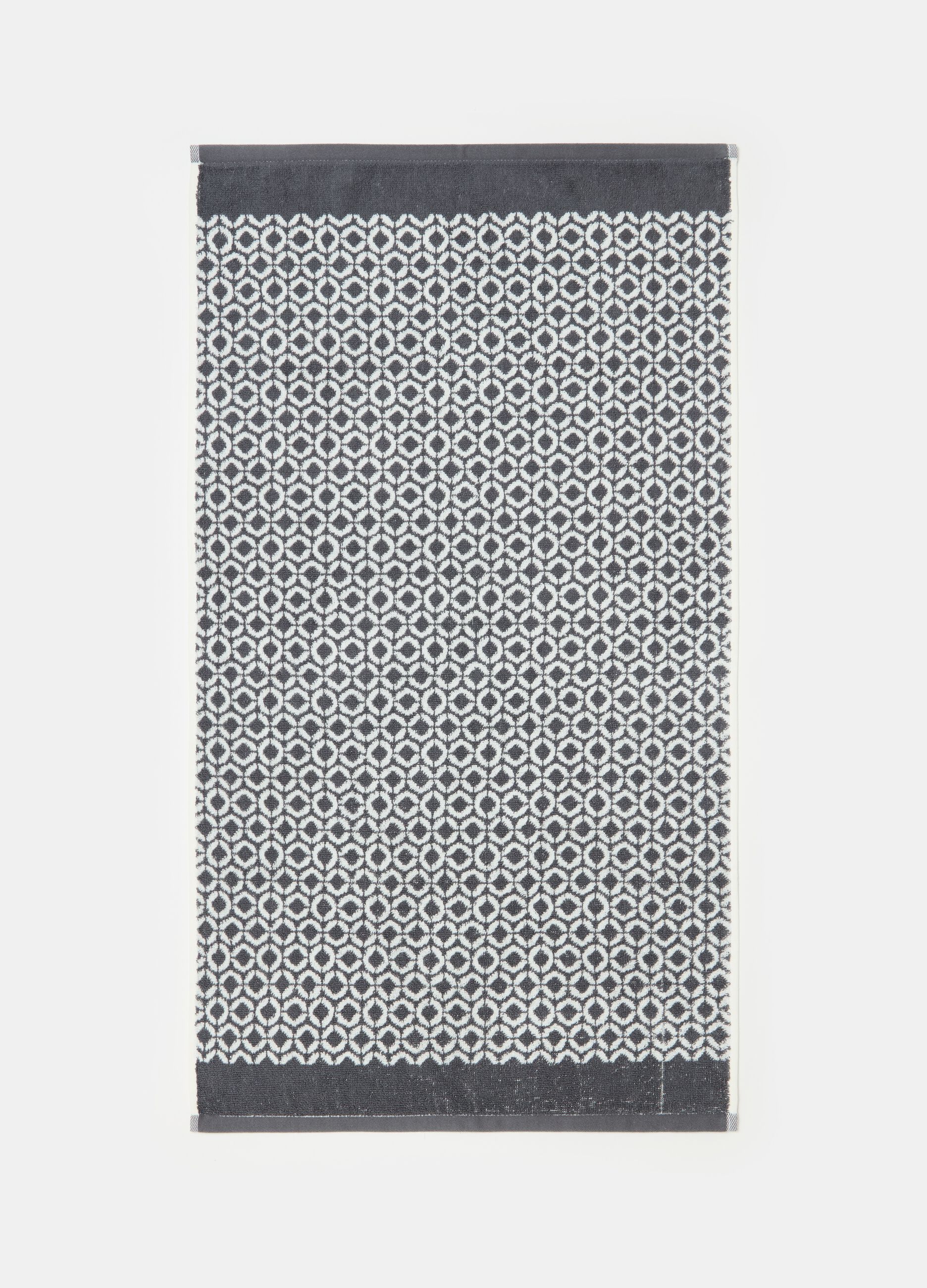 Face towel with dots pattern