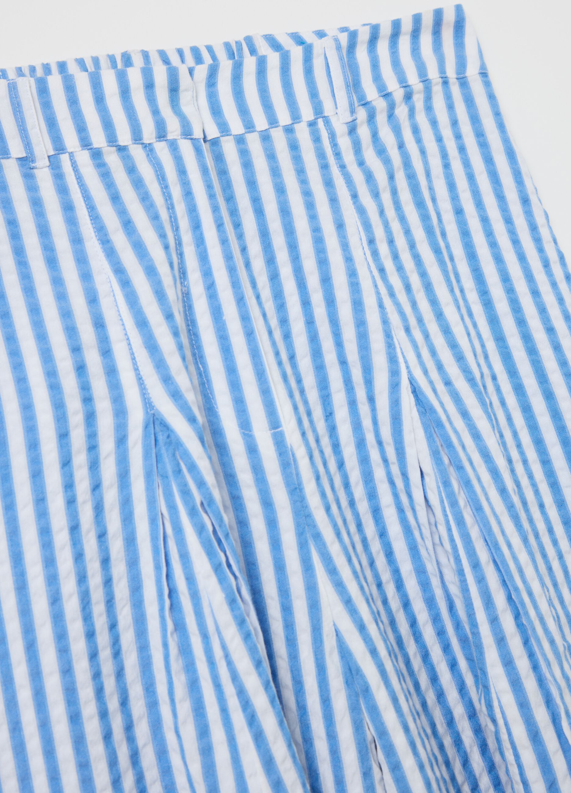 Blue flare-fit trousers in striped seersucker