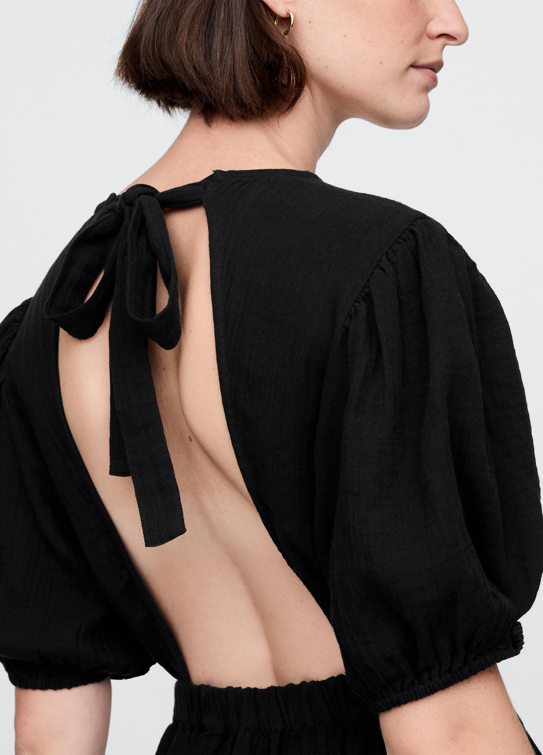 Long black dress with V-neck and open back