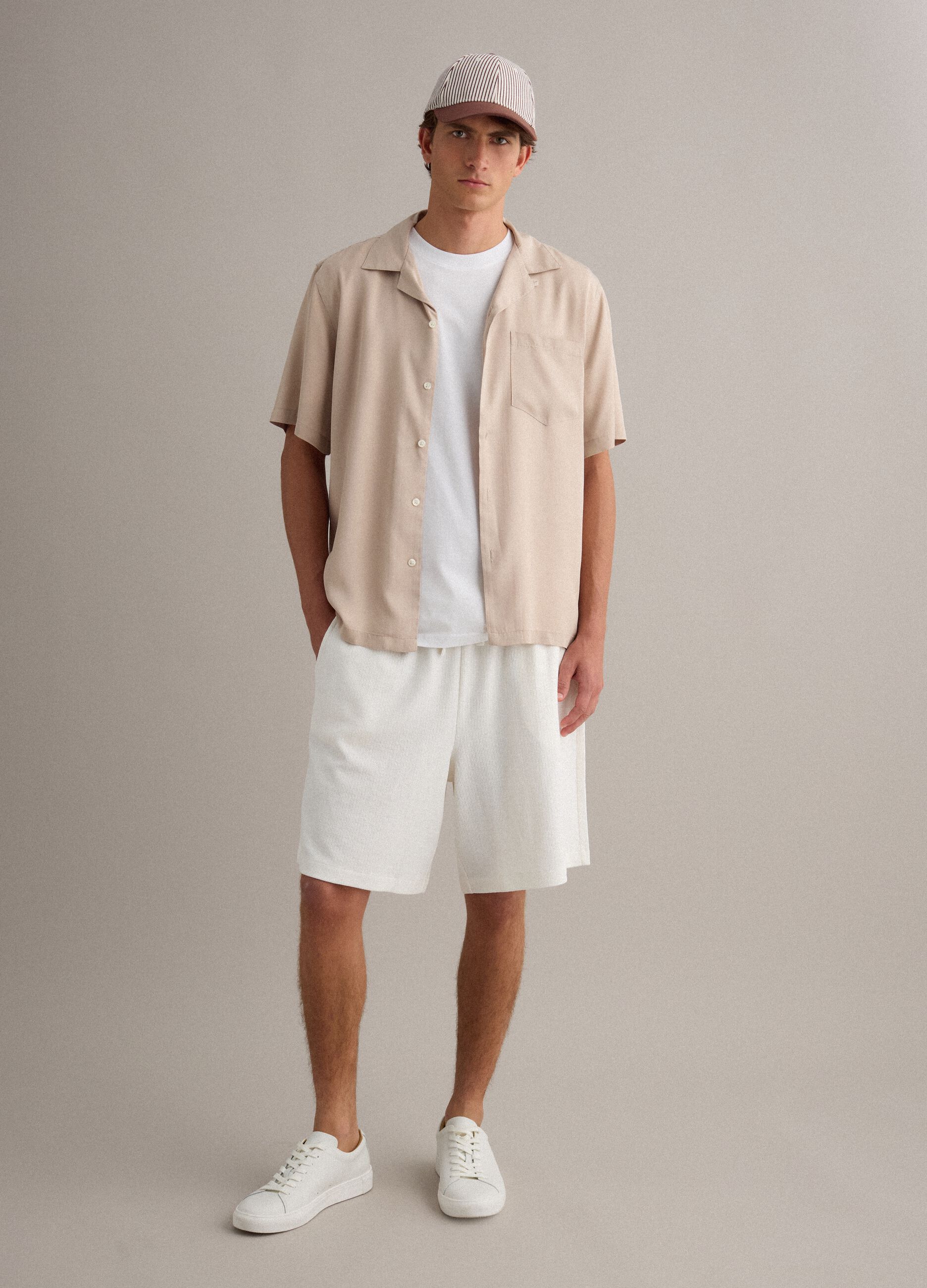 White cotton-blend jogger shorts with drawstring, relaxed fit