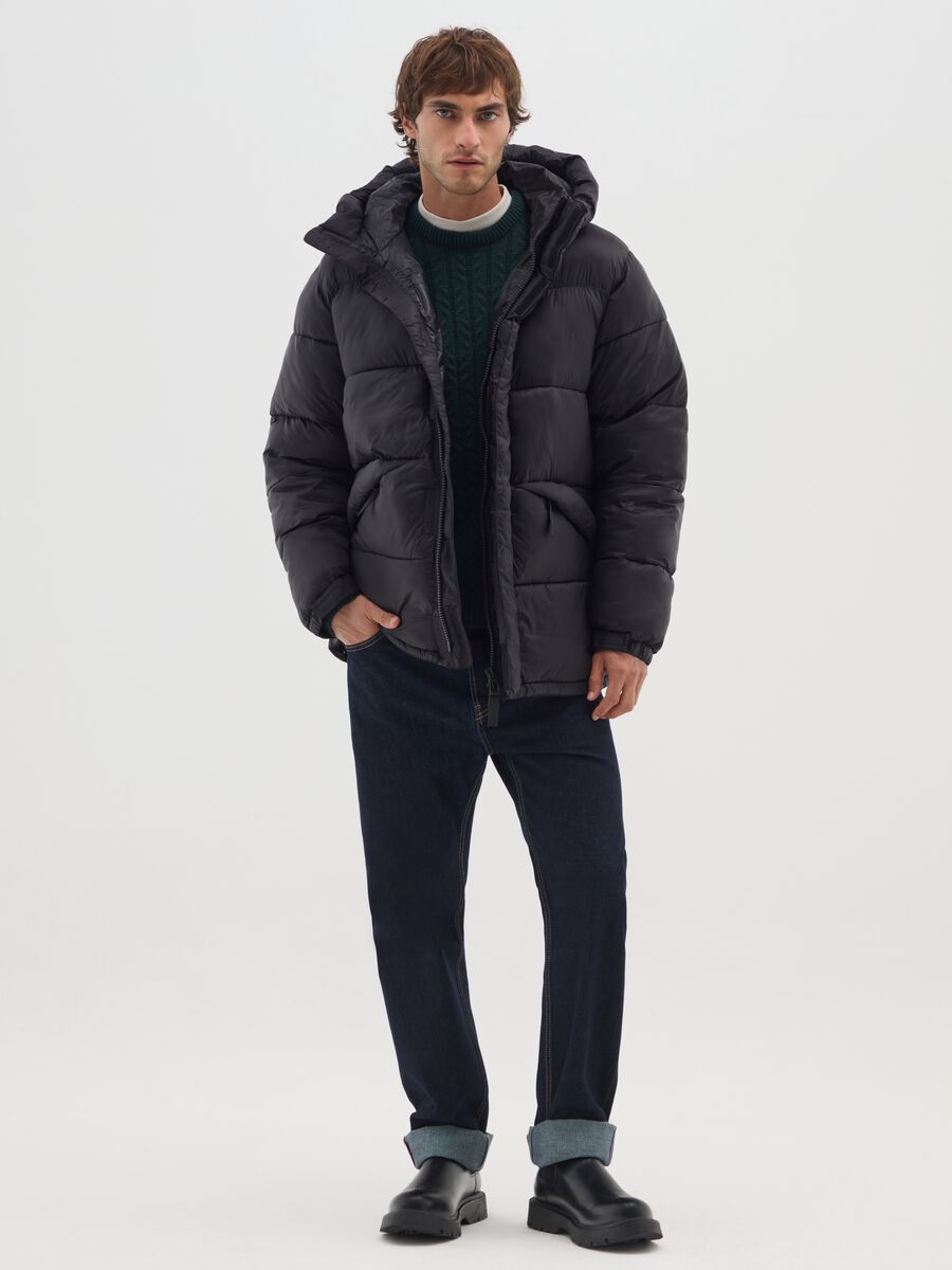 Piumino The Iconic Puffer nero con cappuccio regolabile_1