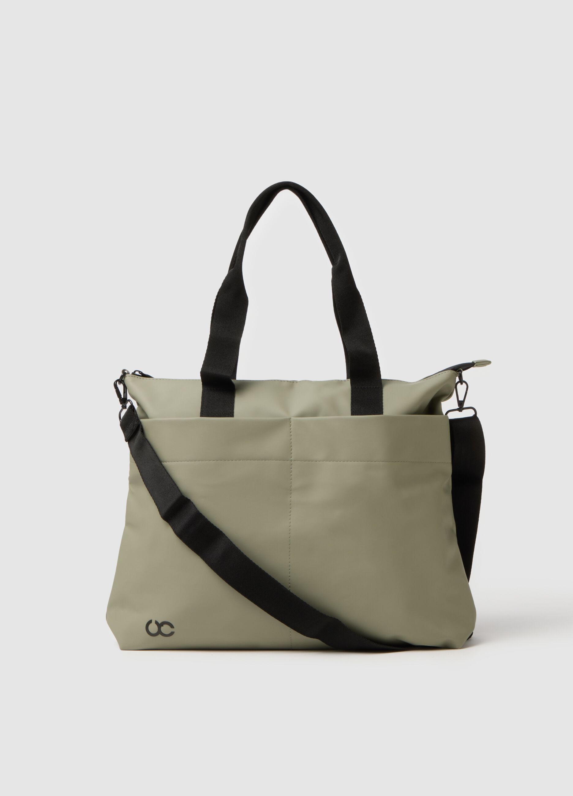 Green tote bag with multiple compartments and adjustable shoulder strap