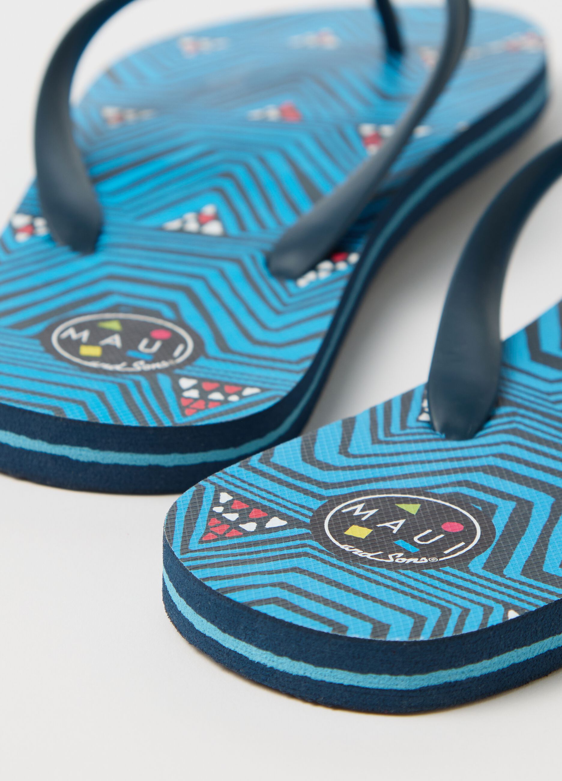 Maui and Sons blue flip flops with geometric motif