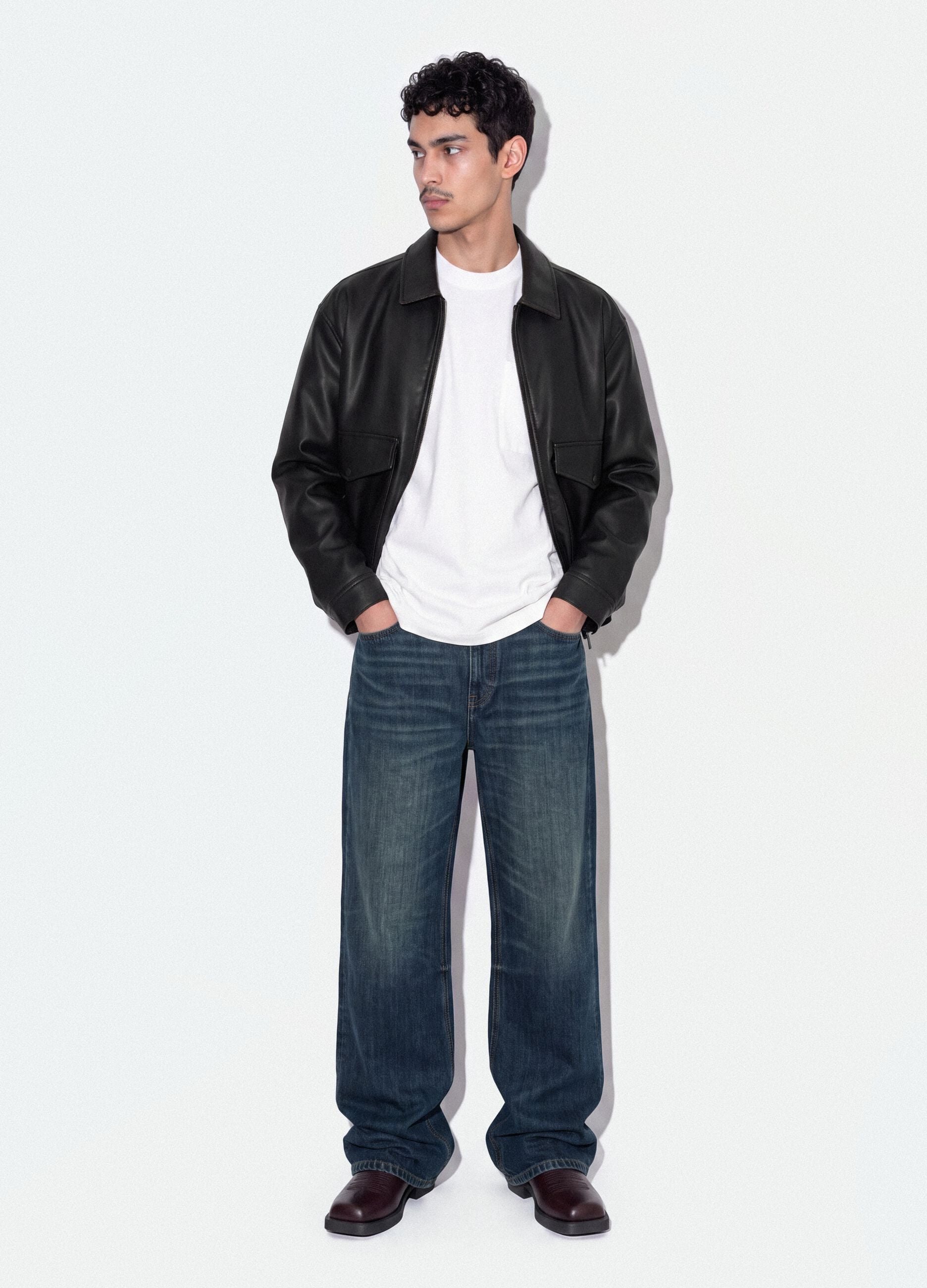 Black cropped jacket with zip and flap pockets, oversized fit
