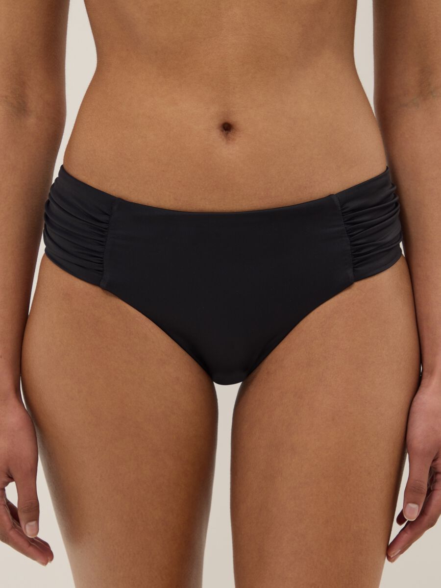 Black stretch swim briefs with side gathers_1