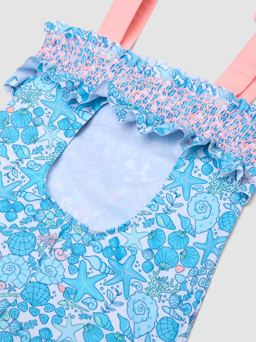 Costume intero azzurro in tessuto elasticizzato con stampa marina per bambina_3