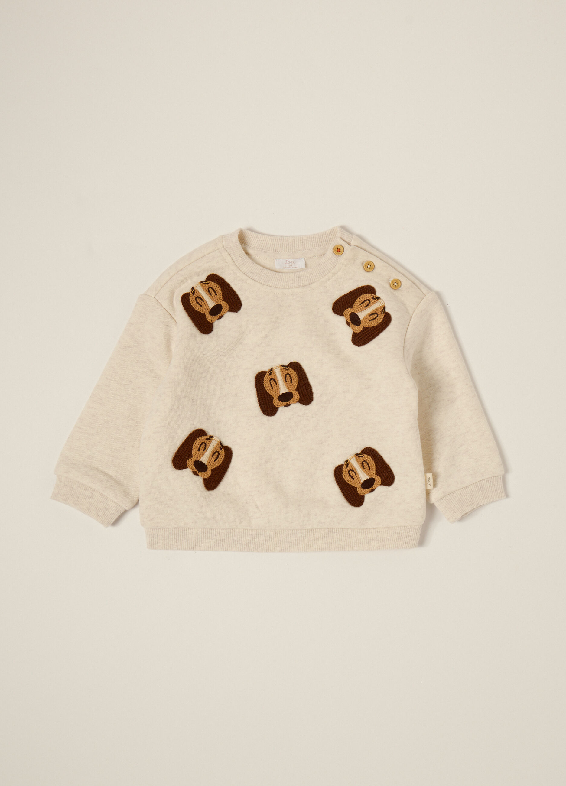 Beige sweater with dog appliqués