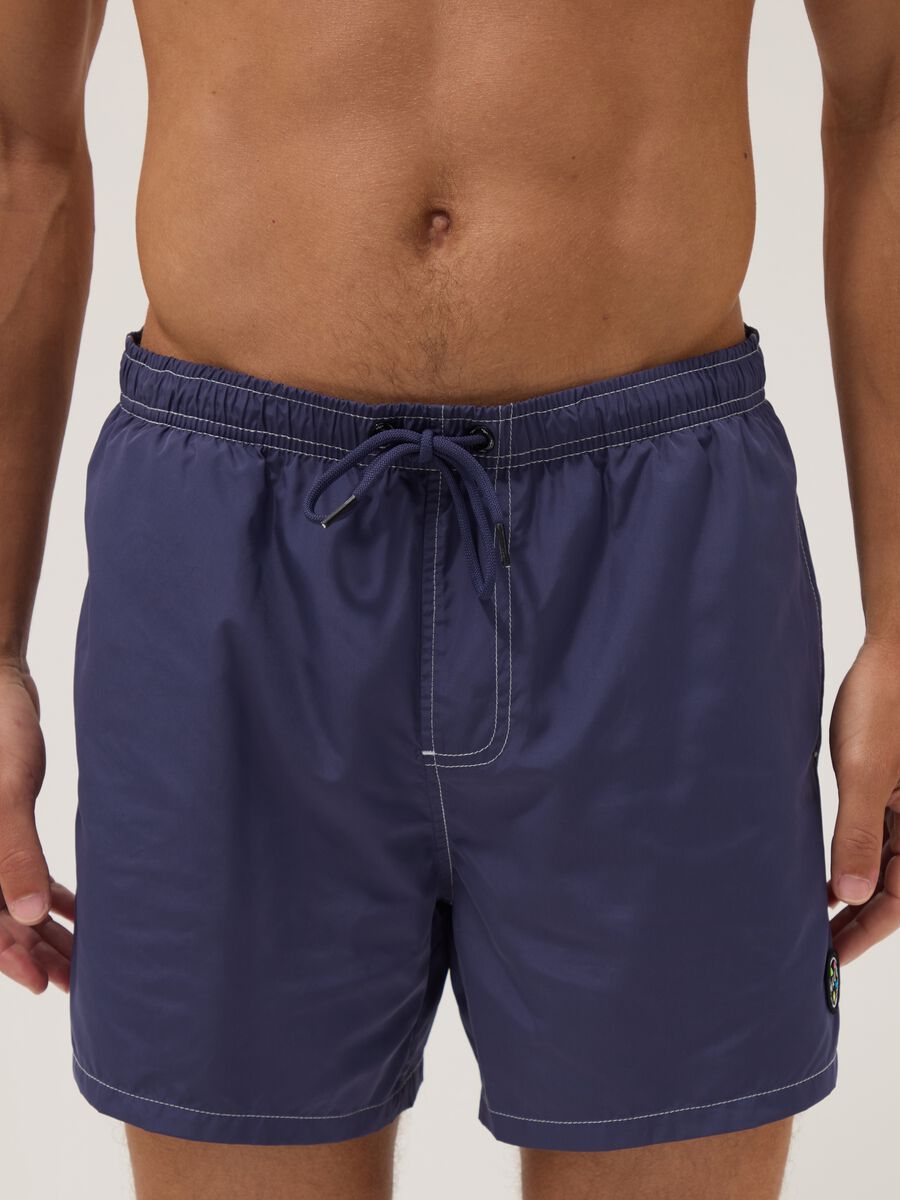 Blue swim shorts with drawstring waist_2