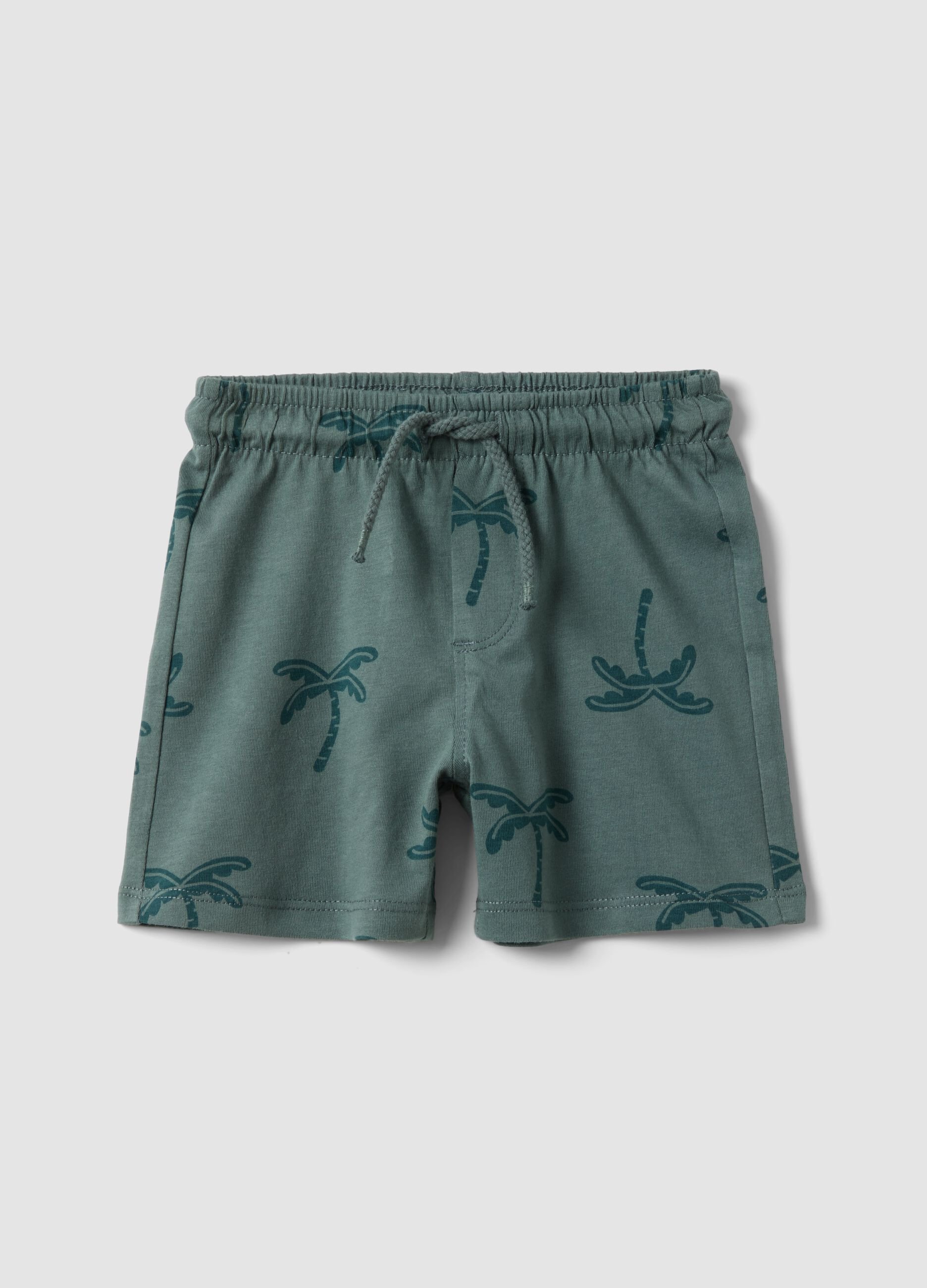 Green organic cotton shorts with palm print