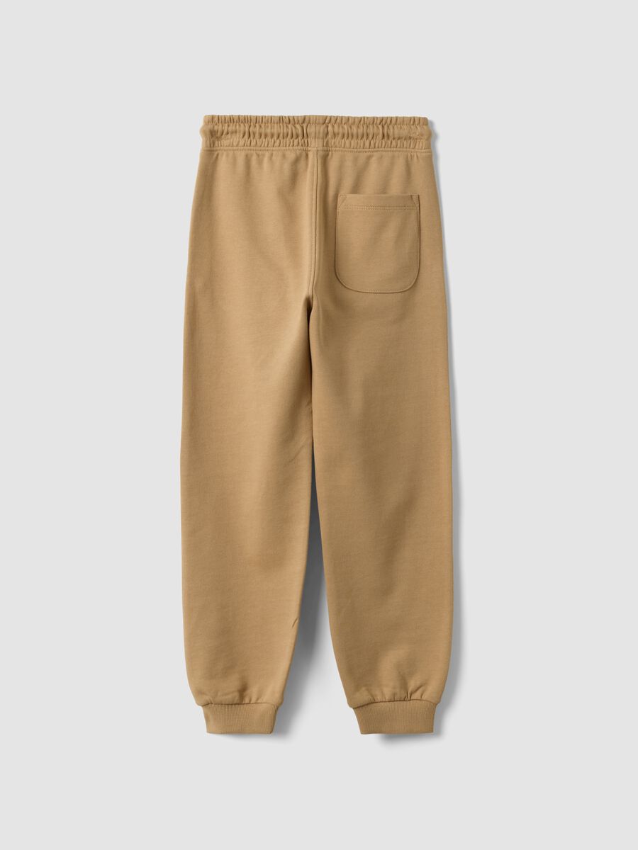 Jogger beige in misto cotone e viscosa con stampa a contrasto per bambino_1