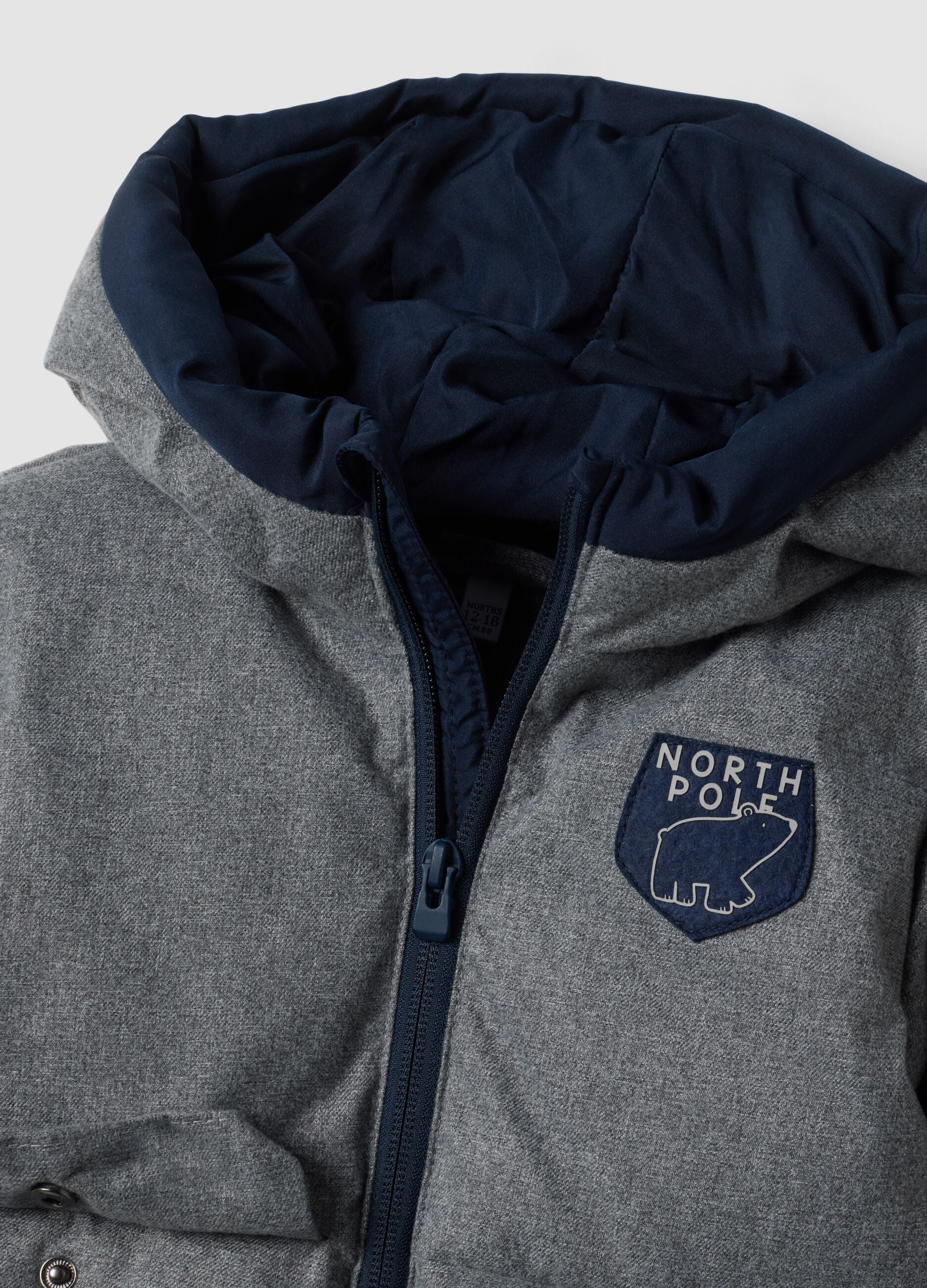 Long grey padded jacket with hood and zip