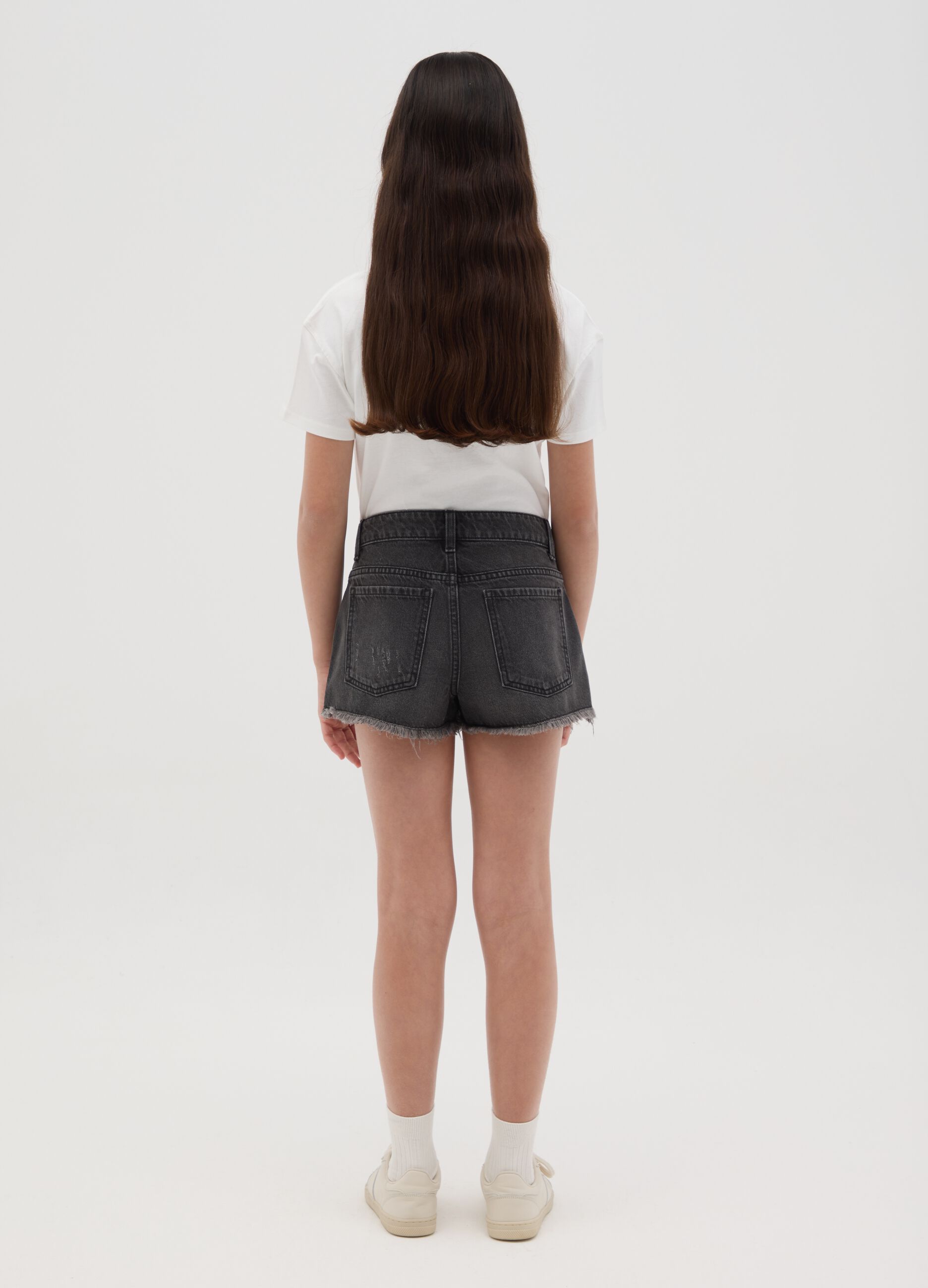 Black denim shorts with a ripped effect