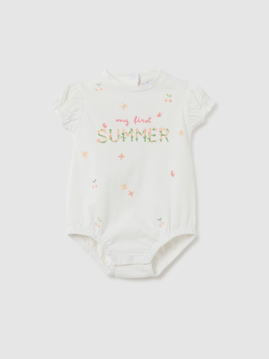 Newborn baby body in pure white cotton with ruffles_0