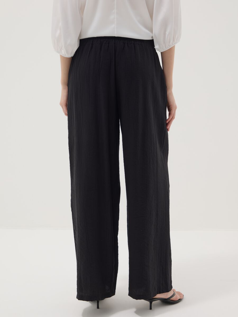 Black palazzo trousers in a viscose blend_3