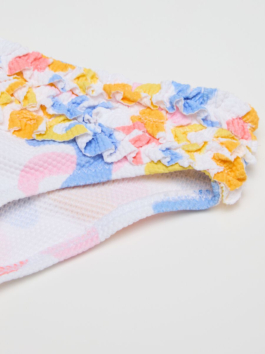 Girls’ swim briefs in multicoloured stretch fabric with frill_2